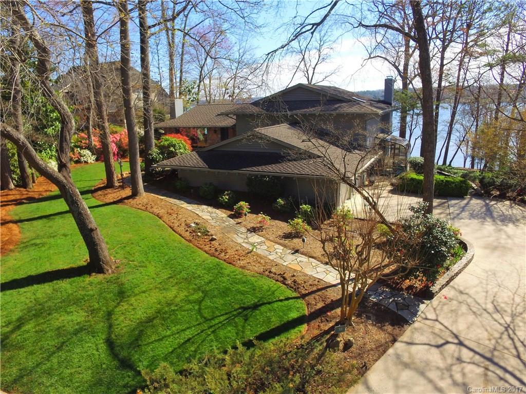 Lake views from nearly every room!  This main channel waterfront home offers 188 feet of shore with dock and boat lift. Located in the sought after River Hill community with security, golf, pool, walking trails and recreation areas. Home features a split floor plan with 4 bedrooms and 3.5 baths and office. Mid level living room and downstairs great room both have fireplaces. Master suite on second floor has bath with separate shower and walkin closet. Minutes from dining/shopping. WON'T LAST!