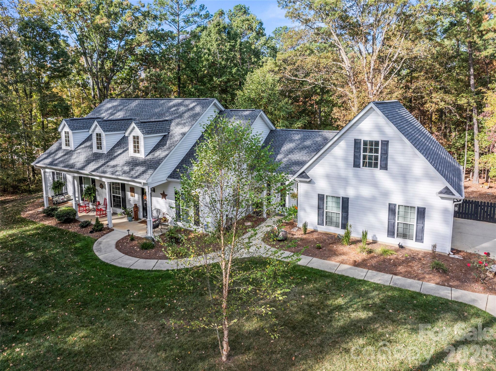 Discover peaceful country living in this meticulously maintained Low Country–style home set on 5 beautiful acres in York, South Carolina. A welcoming front porch invites you to enjoy quiet mornings and breathtaking sunsets, setting the tone for this exceptional rural retreat.
Inside, the home features an updated  modern kitchen with new cabinetry and quartz countertops, opening to a spacious great room with vaulted ceilings and a stacked stone gas log fireplace—perfect for gathering and entertaining. A practical split-bedroom floor plan offers both privacy and functionality. The spacious primary suite showcases tray ceilings and a luxurious five-piece en-suite bath. Additional bedrooms are generously sized and include walk-in closets. Hardwood flooring runs throughout main, Tile flooring in the Bathrooms. The home is complemented by a sunroom/office and an additional front entry for added flexibility.
Recent upgrades include  both a beautiful new roof (2025) and a new tankless water heater, ensuring efficiency and long-term durability. Showings to begin 2/2/2026, weather permitting

Outdoor living is equally impressive, with a  covered porch overlooking the fenced backyard, open  space and wooded shady views to relax. A covered front porch as well as a Covered back patio provide ideal spaces for relaxing after long day at work or entertaining family and friends.

Land & Outbuildings

5 acres of usable, gently rolling land—ideal for a Horse, Outdoor animals, Small Livestock, Birds, Dogs, gardening, or recreation.

Natural gentle slope transition to a creek at the rear of the property.

Barn suitable for horses, small livestock, or equipment storage.

Multiple outbuildings for feed, tools, or hobbies.

Large garage/workshop perfect for tractors, trailers, ATVs, or projects, previous used for wood working. 
Outdoor Shower with Heated water, Multiple Uses.

Four-board fencing along Lawson Farms frames a beautifully manicured front yard . Mature trees provide natural shade, creating an ideal environment for simply enjoying the peaceful rural surroundings.

This property offers a rare opportunity to enjoy space, privacy, and versatility while still having a comfortable, updated home—perfect for an rural lifestyle, mini-farm, or homestead setting.


Land & Outbuildings
5 acres of usable rural land suitable for horses, livestock, gardening, or recreation.

Gently rolling terrain with a natural transition to a creek at the rear of the property
Barn ideal for horses, small livestock, or equipment storage.

Multiple outbuildings for feed, tools, or hobby use.

Large garage/workshop perfect for tractors, trailers, ATVs, or projects.
Pet secure fencing off back patio, keeps the fur babies in sight.

This property offers a rare opportunity to enjoy space, privacy, and versatility while still having a comfortable, updated home—ideal for those seeking a rural lifestyle, mini-farm, or homestead setting.
Four-board fencing runs along the surrounding Sierra Road- Lawson Farms, framing a beautifully manicured yard with a very gentle slope. The land is dotted with mature trees providing natural shade and creates an ideal setting for horses, livestock, or your four-legged friends. This well-maintained outdoor space offers both function and beauty, perfect for grazing, play, or simply enjoying the peaceful rural surroundings.

Lawson Farms properties have no HOA. 

Bush and Vine less than 5 miles away.
 Enjoy rural living, while working in Charlotte 57 minuets drive time to Uptown Charlotte. 37 minuets Gastonia,  30 minuets to drive to  Downtown Rock Hill
Located in Western York County, just West of Highway 321 with Groceries and retail less than 10 minuets away 
Blacks Peaches, Bush & Vine farms close by for farm fresh produce