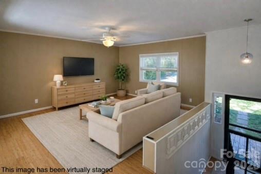 RARE opportunity for waterfront living with a pool on Lake Norman! Nestled on a charming cove, this property offers the perfect combination of lake life, outdoor entertaining, and investment potential. The gently sloping backyard is designed for enjoying the outdoors with a fire pit area, grassy yard, and a pool surrounded by expansive decking for sunning, grilling, and gatherings with friends and family. There is also a private dock for your boat plus a level shoreline ideal for jet skis, paddleboards, kayaks, and more.

This split-level home features 4 bedrooms, 2 full baths, a bonus room, and dedicated office space. The main level offers an open floor plan with spacious living areas plus 3 bedrooms. The lower level includes an additional bedroom with en suite bath, bonus room, and office area—perfect for guests, multigenerational living, or flexible use spaces.

Enjoy incredible views from the oversized 42’ x 12’ upper deck that spans the length of the home and overlooks the backyard, pool, cove, and lake. A covered concrete patio below provides even more entertaining space and includes an oversized outdoor shower. Additional highlights include a one-car garage that doubles as an excellent workshop, circular driveway, extra parking area for a boat or trailer, and a large garden space cultivated by the current owners. No known covenants & no HOA. Fantastic opportunity for a full-time residence, vacation getaway, or investment property!

Dock is permitted and is 12' x 10'
Deck on home is 42' x 12'
Pool decks are 12.5' x 12'      21.7' x 8'  & 10.7' x 8.7'