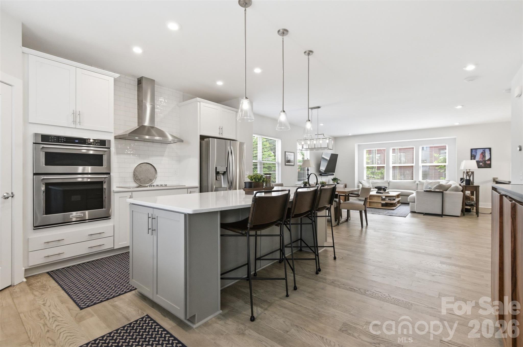 This stunning end-unit townhome is one of the largest in the community, offering four levels of living space with three bedrooms, five baths (3 full 2 half), a two-car garage and a basement with a large enough room for endless possibilities. Less than a mile to all the energy and excitement of trendy Plaza Midwood, this home perfectly balances urban convenience with modern comfort.
Enjoy quick access to some of Charlotte’s most popular restaurants and bars — Supperland, Resident Culture, The Workman’s Friend, and Legion Brewing are just minutes away. Located right on the edge of Uptown Charlotte, you’re only one mile from Spectrum Center and two miles from Bank of America Stadium.
The rooftop terrace offers breathtaking views of the Uptown skyline, making it the perfect spot to entertain or unwind. There also is a new porch right off the kitchen, perfect for grilling! The attached upgrade list highlights the thoughtful details and finishes that make this home stand out.
Location, size, and views — this townhome truly has it all. Don’t miss the chance to experience Charlotte living at its best.