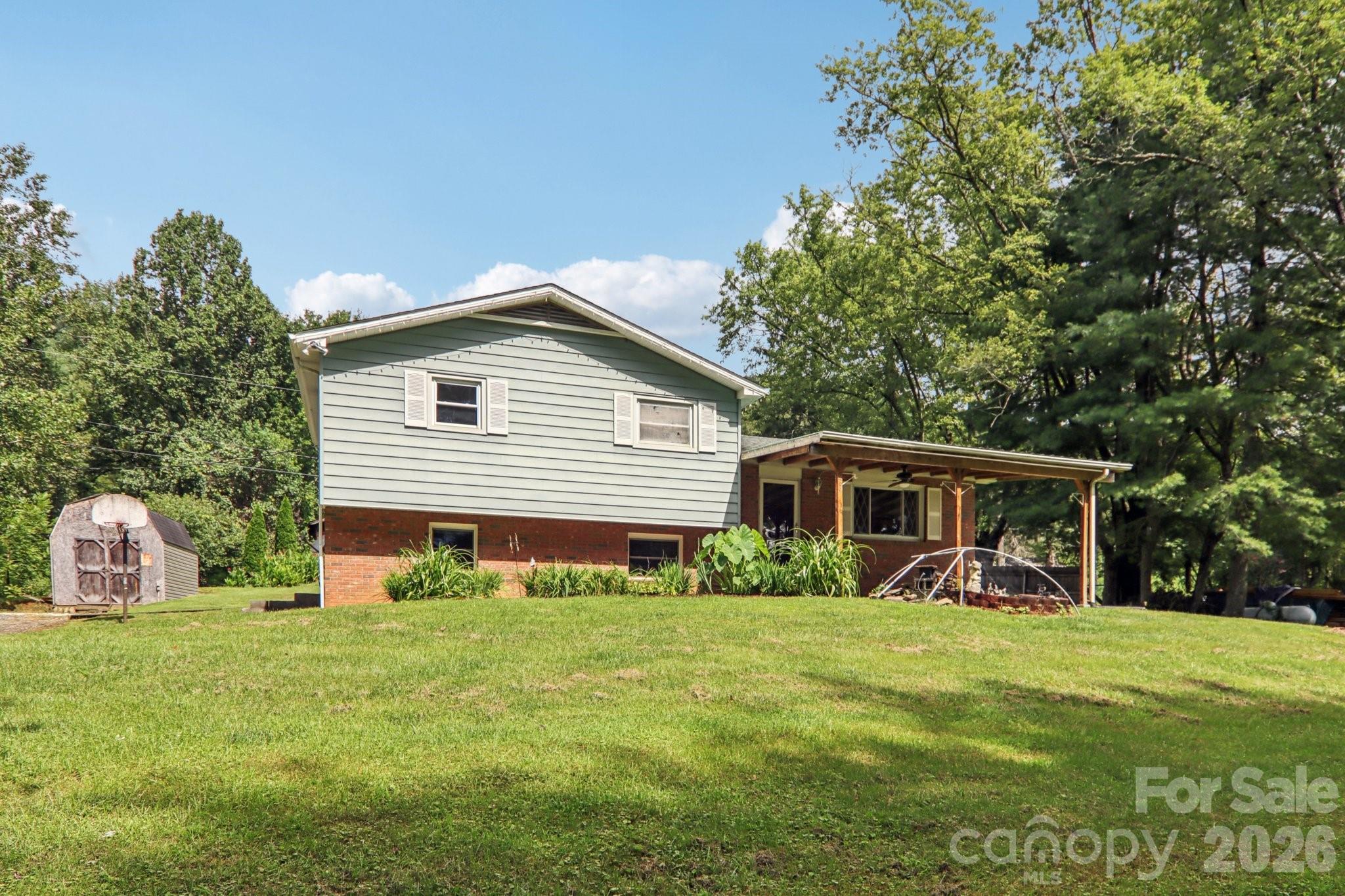 Charming, Updated 3-Bedroom, 2.5- Bath Home in the Heart of Mills River! Recent upgrades include a New HVAC system (2024), fresh interior paint throughout, new flooring, and stylishly renovated bathrooms featuring new vanities and flooring. Enjoy peace of mind with updated plumbing and a new main water line, plus ample outdoor storage with a large storage building and an additional shed in the backyard—perfect for hobbies, tools, or outdoor gear. Ideally located just minutes from the Asheville Regional Airport, this home offers easy access to shopping, restaurants, local breweries, and is perfectly situated between Brevard and Asheville. Outdoor enthusiasts will love the proximity to Pisgah National Forest and DuPont State Forest, offering endless opportunities for adventure.