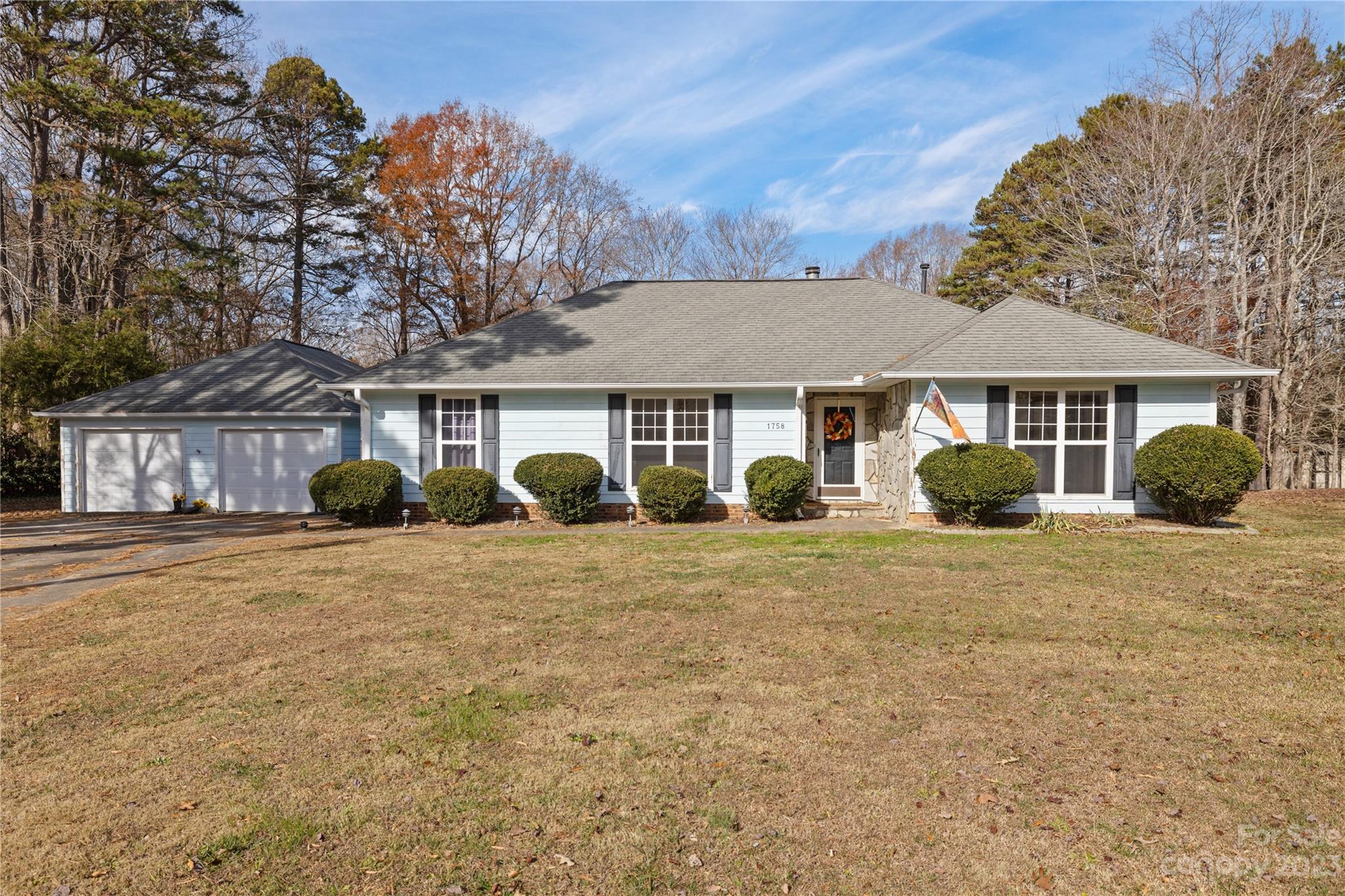 Welcome to this spacious, well-loved ranch home on a large lot in a nice quiet lake community. Well-maintained and ready to be made your own. Cathedral ceilings w/wood beams. Real custom 5'og wood moldings around doors, crown & chair moldings, 42' oak cabinets, and tile floors. Light & bright wood-burning fireplace, brand new private deck and brand new HVAC. 2.5 car detached garage w/'bob villa' workshop. Huge partially fenced yard on cul-de-sac street with nice proximity to the lake. The property will be sold as is but no known problems.