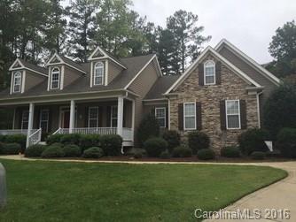 Well-kept, move-in ready stone front ranch home on large cul de sac lot in beautiful lake community.  Spacious open floorplan.  Don't miss this opportunity; main floor includes formal dining room, sunny breakfast nook, kitchen that opens to great room with gas log fireplace and soaring ceilings. Huge master suite and 3 additional bedrooms (one with french doors can be an office).  Finished bonus room/game room above garage.  Covered rocking chair porch on front & rear.  Fenced backyard.
