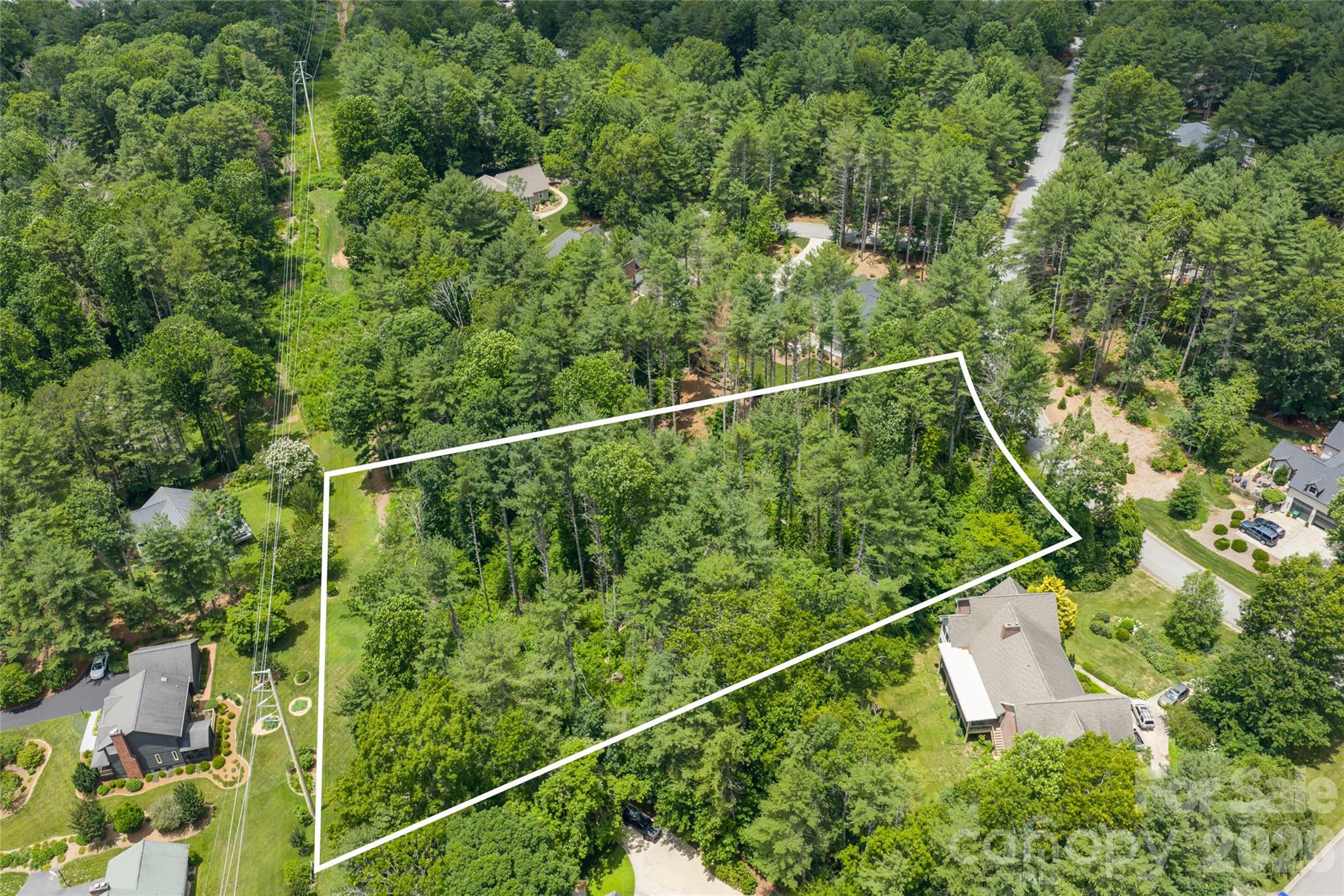 Rare opportunity to build your custom dream home in the established Coventry Woods community of Arden. This beautiful 1.7-acre homesite offers a predominantly level building area with mature trees and a private setting, creating the perfect backdrop for your future residence. Enjoy the ideal combination of tranquility and convenience, just minutes from shopping, dining, medical facilities, schools, the Blue Ridge Parkway, and Asheville Regional Airport. Residents of Coventry Woods enjoy access to nearby hiking trails and the charm of one of South Asheville's most desirable locations. Bring your vision and create the home you've always imagined in this exceptional neighborhood.