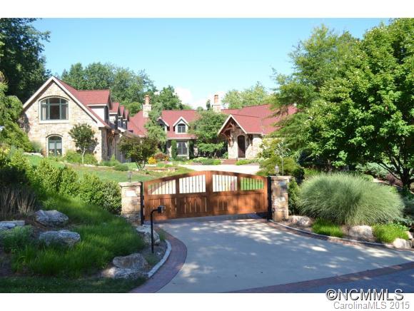 This luxury, gated estate near downtown Asheville is situated on over 3 private acres and bordered by a bold creek. Designed by Mark Sinsky & built by Robey Wright, you will find gracious appointments throughout this exquisite home. The interior features breathtaking woodwork, massive ceilings, 3 large FPs & a 1000 bottle climate controlled wine closet. 3-car garage w/ showrooms. Unmatched quality and attention to detail!  See list of features!