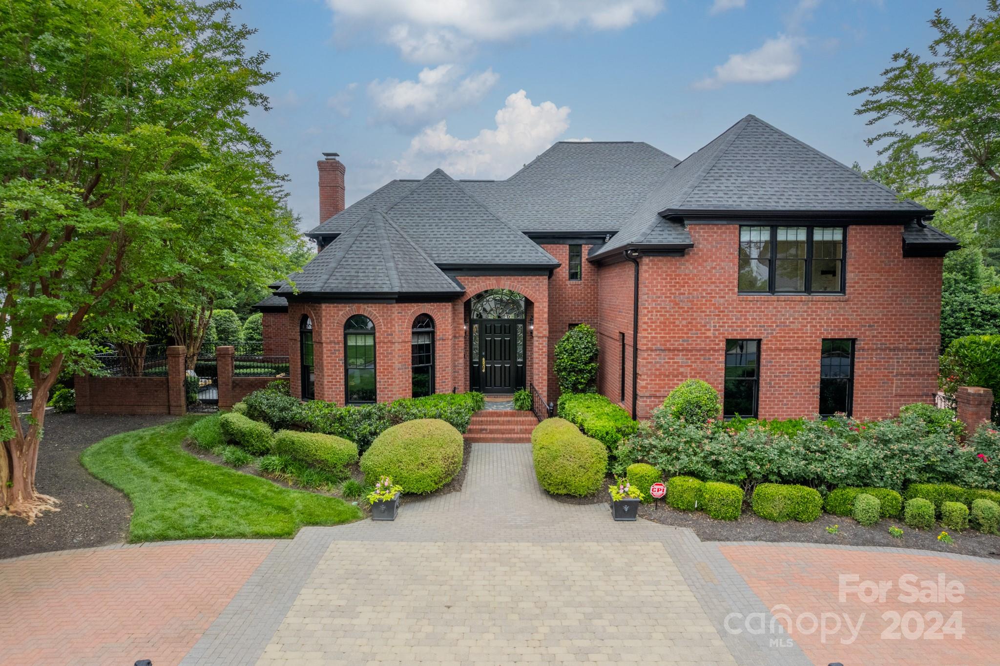 A Stunning Renovation to this gated Morrocroft property on a private interior lot. Modern Elegance at every turn. Renovations in 2020/21. Soaring 18 ft ceilings when you enter w/ a moody green office just inside. 5" White Oak HW's. Dining room w/ a barrel ceiling & RH brass chandelier has doors leading out to a flagstone terrace. Experience a true chef's kitchen w/ 2 islands, 2 Gaggenau dishwashers, 2 sinks & a 48" Monogram 6 burner gas range w/ griddle. Custom Black and White Oak cabinetry, shiplap range hood, coffee bar & floating shelves. From the LR w/ a brass RH Chandelier & heavy millwork, doors lead to a shaded courtyard w/ Trex decking, gas fire pit & TV cabinet. Off the 2 story great room is an intimate sunroom w/ a Tricorn black ceiling. Primary on main features a vaulted ceiling, dual closets & french doors that lead to the back terrace. PBath has an RH vanity, sconces & mirrors. The conveniences of Southpark are just blocks away. Too many features to mention, a must-see.
