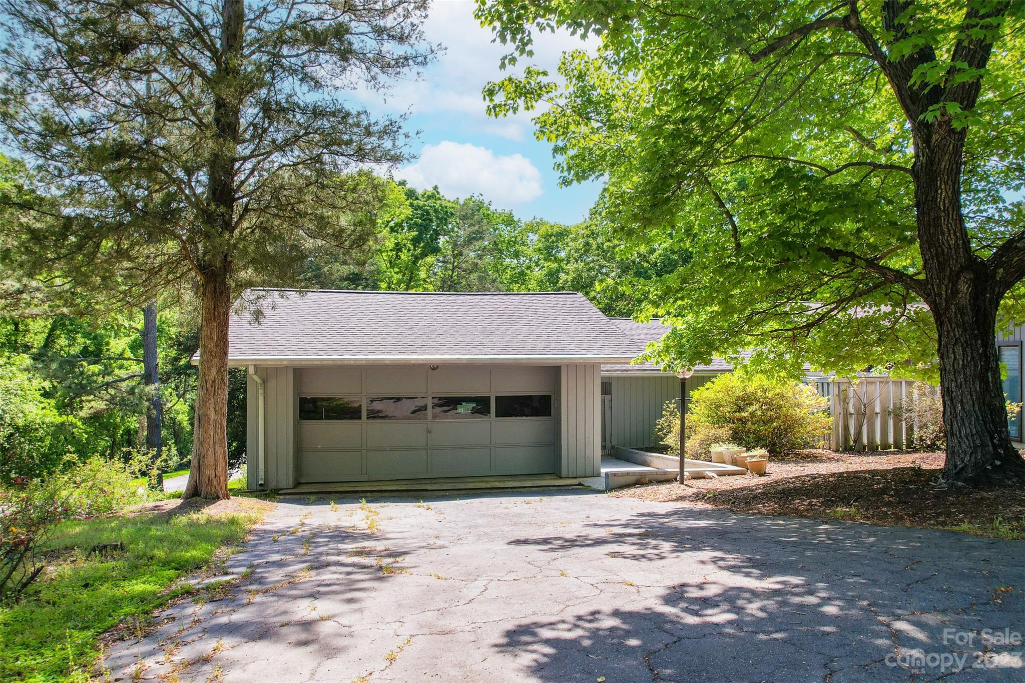 Fabulous opportunity to live in sought after River Hills! This home features the primary bedroom and 2 additional bedrooms on the main level, a large living room open to the dining room/area and spacious above ground basement w/an additional bedroom and sliding doors allowing walk out access. Enjoy the charming enclosed courtyard and several decks for outdoor living. River Hills is a gated community that offers a multitude of amenities, miles of trails, a waterfront beach park, playgrounds, marina, country club with renowned golf course, and 24-hour security. Also enjoy the award-winning Clover School district and close proximity to the airport, Charlotte, Fort Mill, and more!