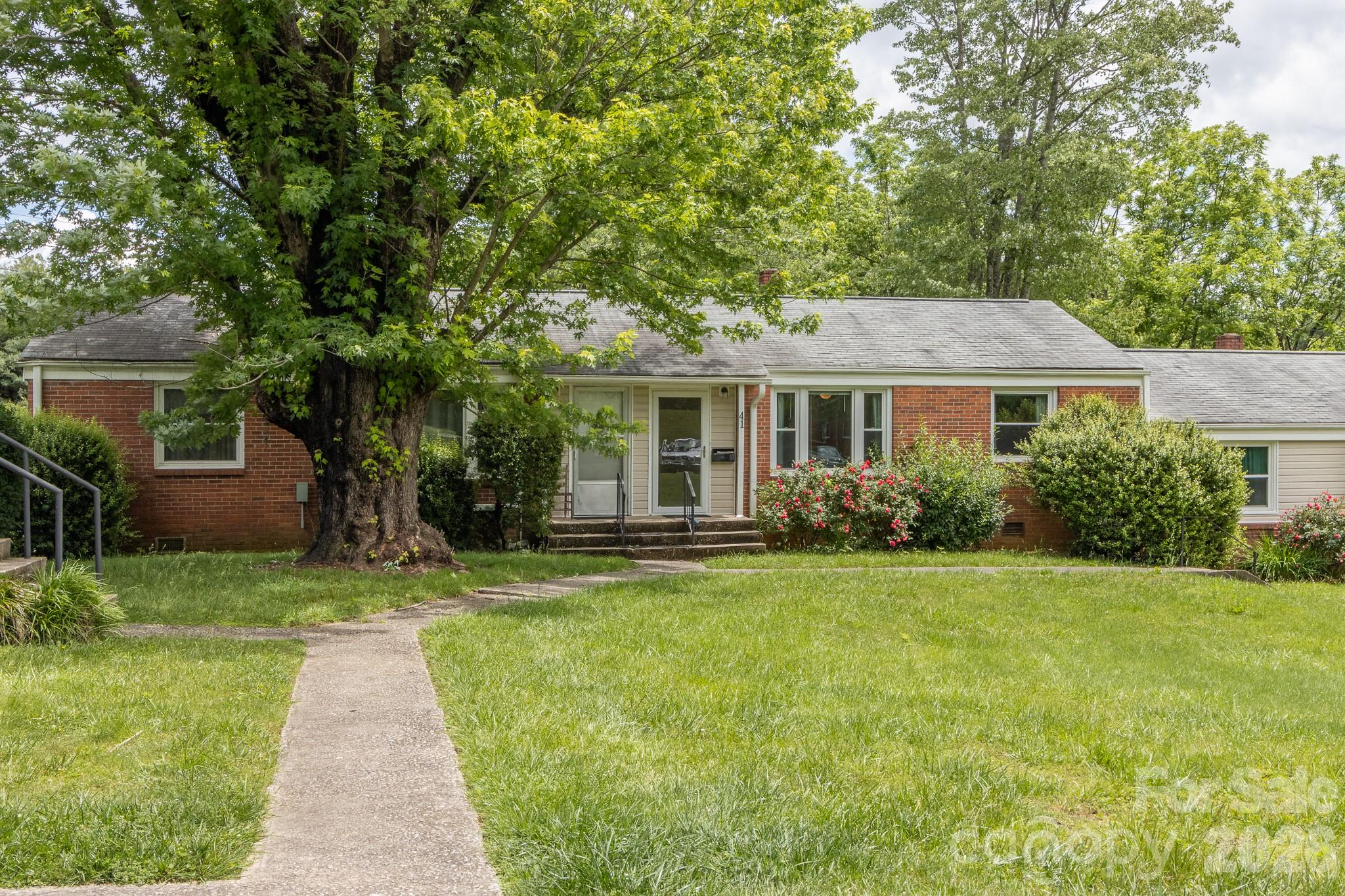 Ideally located condominium in the ever popular Sapphire Manor neighborhood. Authentic wood flooring and shiplap accent walls bring character to the living and bedroom areas. The galley style kitchen brings convenience and utility with the connected laundry room which could double as pantry space. The living area looks out over a nicely manicured greenspace and a back deck area or patio space could be added for outdoor entertainment.  The unit features a rear and front entry, one-level living, ease of access, and walking distance to everything downtown Brevard has to offer make this property a true gem.