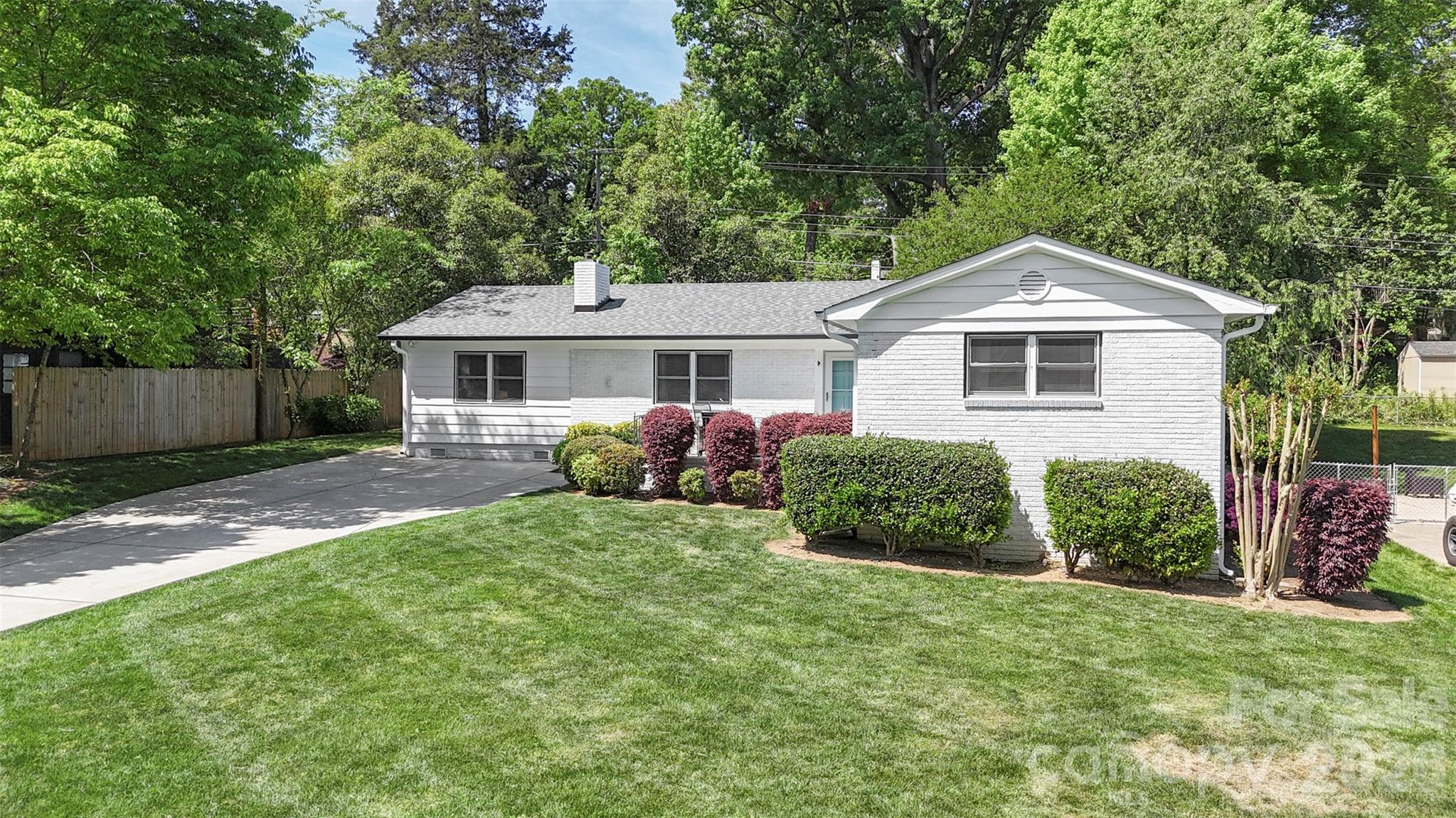 Welcome to this spacious ranch with NEW ROOF in sought after Madison Park! As you walk in you are welcomed by the natural light-filled living room with cozy fireplace and original hardwood flooring. Enjoy your open concept kitchen and dining area with large island, ample storage, and countertop space for all your entertaining and culinary needs! Off the kitchen you will find the oversized laundry room with storage followed by the bonus room/flex space PLUS powder room for ample uses! This 3 bedroom, 2.5 bath ranch home offers a spacious primary bedroom with fully updated private en-suite. The two additional bedrooms offer ample space for guests, an office, a growing family and so much more. Your fenced in back yard offers a mix of shade and sun with room to put your personal touches on plus powered storage building for all your shop, landscaping, or storage needs. When you want to get outside and explore, find the Little Sugar Creek Greenway access, SouthPark, Uptown, SouthEnd and so much more just moments or a quick commute away! This home includes many NEW and updated/upgraded features: NEW roof (2026), crawl space barrier and dehumidifier (2022), electrical service, panel and outlets (2022), washer/dryer (2022), HVAC ventilation upgrade (2022), primary ensuite (2025).