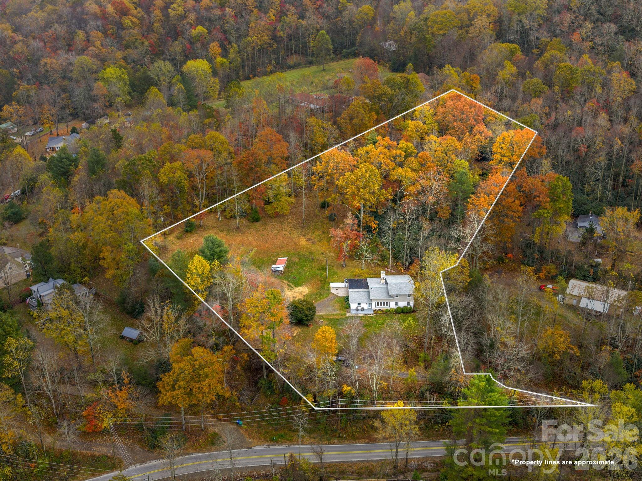 FAIRVIEW BEAUTY ON 2.58 GORGEOUS, USABLE ACRES WITH NEW ADDITION & TURNKEY UPDATES! Exceptionally maintained and thoughtfully renovated 4BD/3BA home offering 2,834± sq ft of comfortable, flexible living in peaceful Fairview. Designed for both everyday ease and effortless entertaining, this home features a serene main-level primary suite and an inviting open floor plan enhanced by rich hardwoods and radiant heated tile floors. The newly renovated gourmet kitchen is a true centerpiece, showcasing granite countertops, double ovens, and a gas cooktop perfect for gathering and creating memorable meals. A spacious addition offers incredible versatility with options for a home office, media room, playroom, and private ensuite guest quarters. Generous secondary bedrooms and updated baths in the original home provide comfort and privacy for family and guests alike.
Major system updates including a new roof, HVAC, and expanded four-bedroom septic system ensure peace of mind and truly turnkey living. Set on 2.58 beautiful, usable acres, the property offers endless possibilities for outdoor living, gardening, or simply enjoying the privacy and tranquility of Western North Carolina. A rare Fairview gem that's move-in ready and waiting to welcome you home. Short-term rentals permitted!