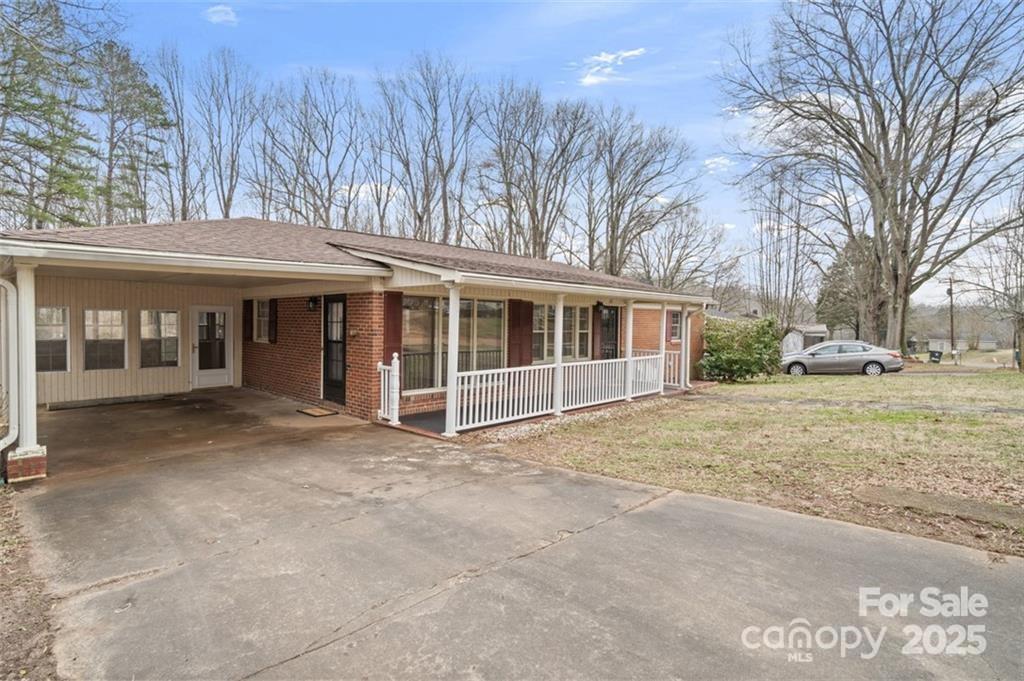One level living at it's best. This remodeled brick ranch is perfect for entertaining guests with its large den, kitchen area with a pass-thru breakfast bar, stainless Frigidaire appliances, granite countertops and Daltile Herringbone backsplash. You'll find newly installed luxury vinyl plank flooring in the kitchen and den areas leading to beautifully refinished original hardwood flooring in the living room, hall & bedrooms. Your bathroom possesses gorgeous cabinetry featuring soft-close doors & double vanities. The American Standard soaker tub w/ tile surround, rainfall showerhead & elegant tile flooring making this bathroom your sanctuary. Step out on the covered front porch, a perfect spot for enjoying your morning coffee or the spacious sunroom for relaxing, entertaining, crafting or even a man cave! The sizable back yard includes a shed for storage. Located in walking distance to W. Madison St. where you can enjoy local eateries and unique shopping. HOME IS BEING SOLD AS IS.