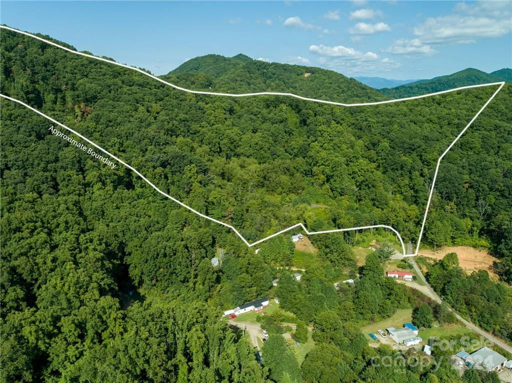 Build your dream home on over 21 acres of beautiful land with  1000 feet of ridge crest with long range views overlooking Pisgah National Forest.
Build your new home or subdivide for multiple home sites. Beautiful mountain and valley views, while close to shopping, schools, employment centers and entertainment. Will consider trade of equal value. Agent owned. Old septic tank is on property.