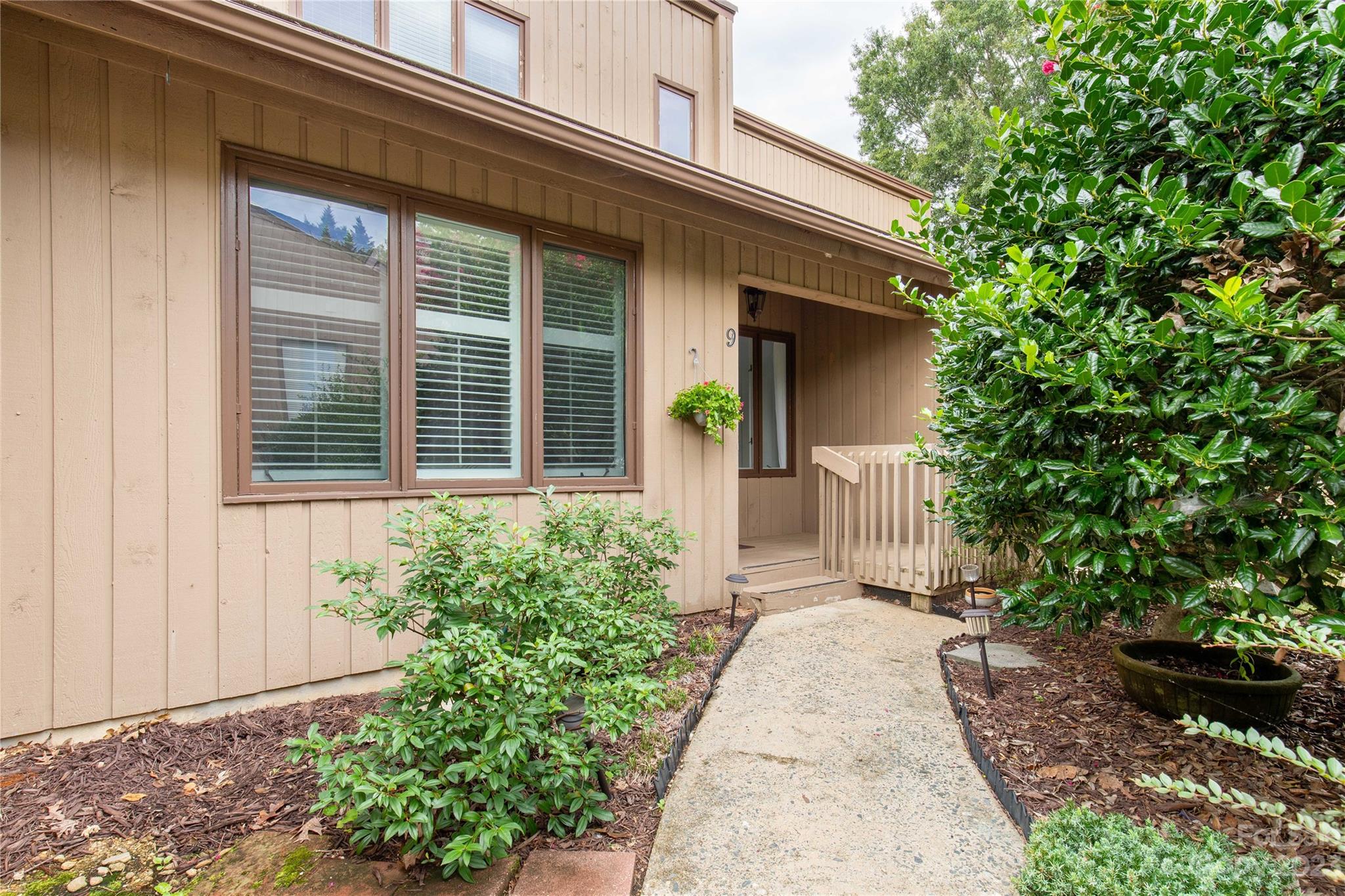 Do you want to come home to boats and water views? This maintenance free, adorable, move in ready condo with views of the Marina is just what you need! We love the abundance of natural light that pours into this 2 story, 2 bedroom unit. This unit features an open floor plan with an enclosed sun room perfect for relaxing. Primary bedroom is on the main level with an en suite bath. Laundry on main level. Huge kitchen bar for seating for 4 and Solid surface counter tops.  Secondary bedroom is upstairs with an en suite bathroom as well. We love the upgrades like the plantation shutters and new flooring. The community is amenity rich with golf and country club, community marina, playground, lake park, community garden, dog park, and miles and miles of scenic sidewalks 24 hour gated and EMS on-site offers the ultimate security. Short term rentals are not permitted. Dual HOA ask for more details.