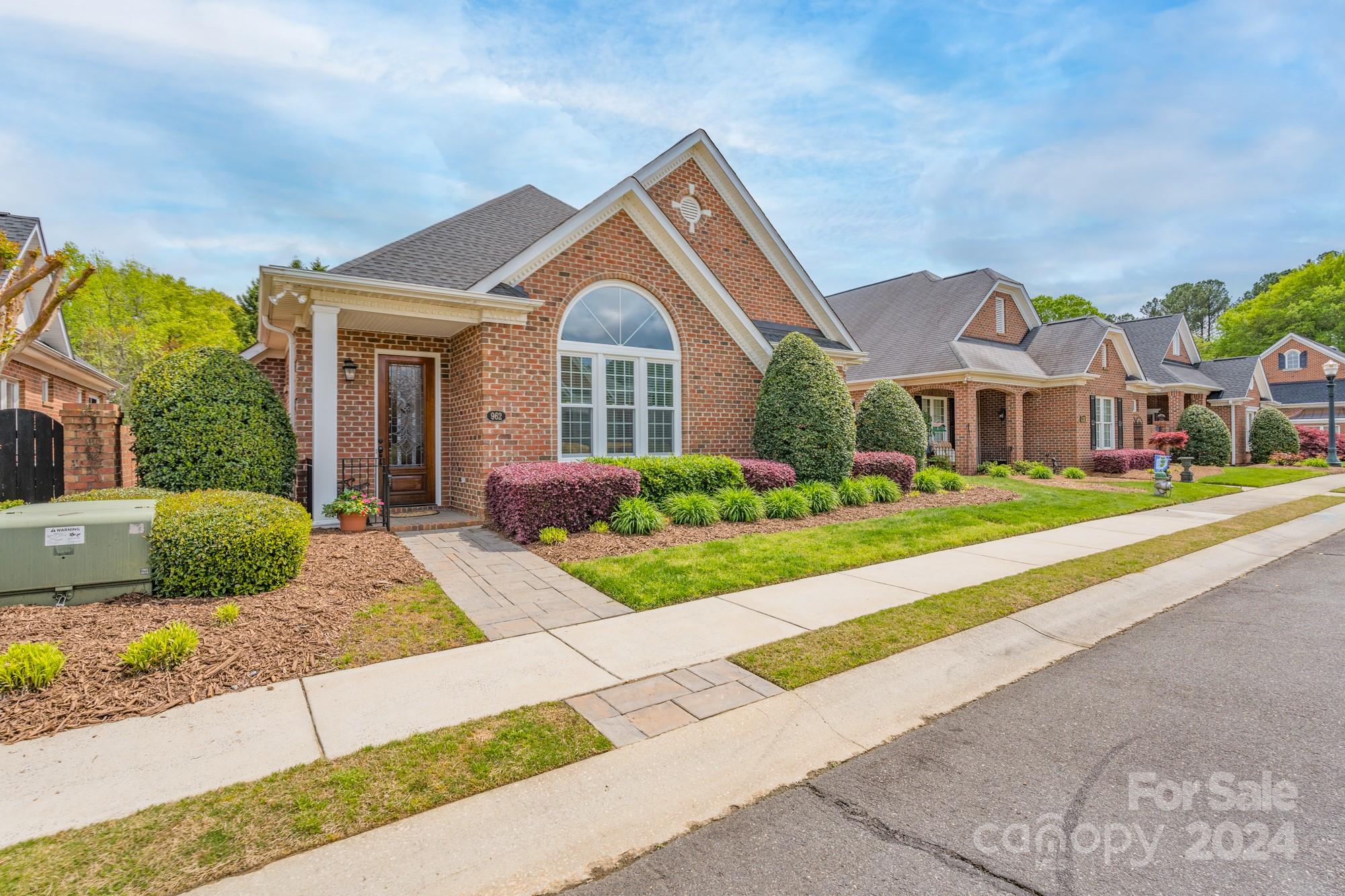 From the moment you walk through the front door, you will find that you are right at home in this cottage that has been meticulously maintained and updated.  The openness of the floor plan provides a warm environment that is ideal for entertaining.  The family room features a gas log fireplace and custom built-in bookcases.  Enjoy preparing meals in the kitchen that boasts a gas range, stainless refrigerator, and beautiful cabinetry.  The primary bedroom is spacious and includes a private bathroom with jacuzzi tub, double sinks, and tiled shower.  There are two additional bedrooms on the main floor that share a second full bathroom.  Working from home? One of the bedrooms has been upfitted as an office with a custom built-in desk and bookcases.  Upstairs is home to a large bonus room that offers many possibilities.  Take a walk outside to the screened porch that overlooks your own private haven and relax in the soothing sounds of the waterfall koi pond located in the private courtyard.