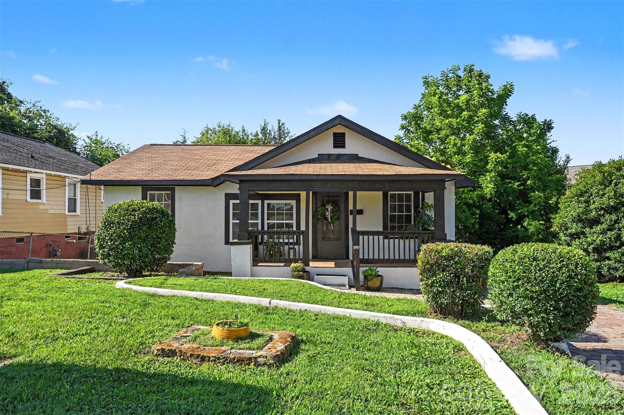 *Professional pictures, measurements will be uploaded later today! Welcome to this charming, updated 1-story ranch-style California bungalow, perfectly situated in a rapidly developing area with unbeatable proximity to the heart of the city! Boasting fantastic curb appeal and tasteful landscaping, this approximately 1,000-square-foot gem is tucked away as the last home on a short street, offering an extra layer of peace and privacy on its 0.12-acre lot. Inside, you will find a beautifully refreshed interior featuring 3 comfortable bedrooms with brand-new carpet, and valuable updates throughout—including updated windows and a brand-new HVAC system for ultimate peace of mind. The property also highlights a wonderful private backyard that serves as your own quiet outdoor retreat, all with the rare freedom of no HOA restrictions. Bonus detached back building offers incredible value-add potential! While it needs some repair, it is a true blank canvas ready to be transformed into a private studio, home workshop, or extensive storage space. The location is an absolute urban dream, placing you within easy walking distance to Camp North End, just a short drive to Uptown, and minutes away from an array of popular local restaurants and shopping. Blending classic bungalow charm, essential modern upgrades, and an exceptional high-growth location, this turn-key property is a standout opportunity that is ready for you to move right in or an income earning property!