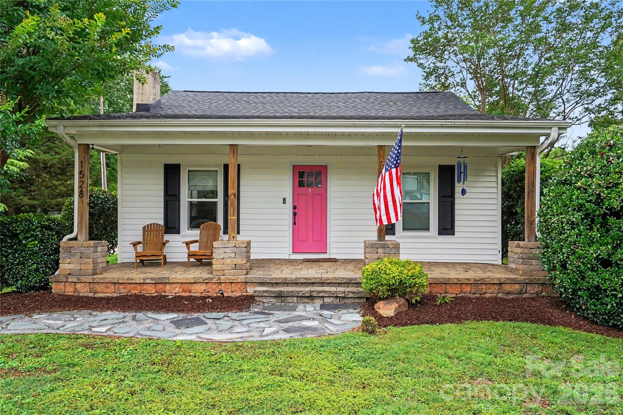 Excellent opportunity in Belmont! This recently updated bungalow sits on over 1.3 acres, and simply has it all. Step past your rocking chair front porch into your cozy, yet spacious living space. Host the whole family in the entertainer's kitchen, featuring freshly painted cabinets, gleaming hardware and backsplash, can lights, a gas range and an oversized farm sink. The primary bedroom boasts cathedral ceilings, a walk-in closet, and a fully updated en suite with new tile and hardware. This charmer has another large bedroom, a half bath, and a fully finished attic, great for storage. But outside is where the party is at! Private extended patio with a built-in bar, with a newly wired pergola for lighting and TV. Multiple outbuildings, including a usable space perfect for an at home office or gym. Large storage barns/sheds and another outbuilding with plumbing. Schedule your showing today!