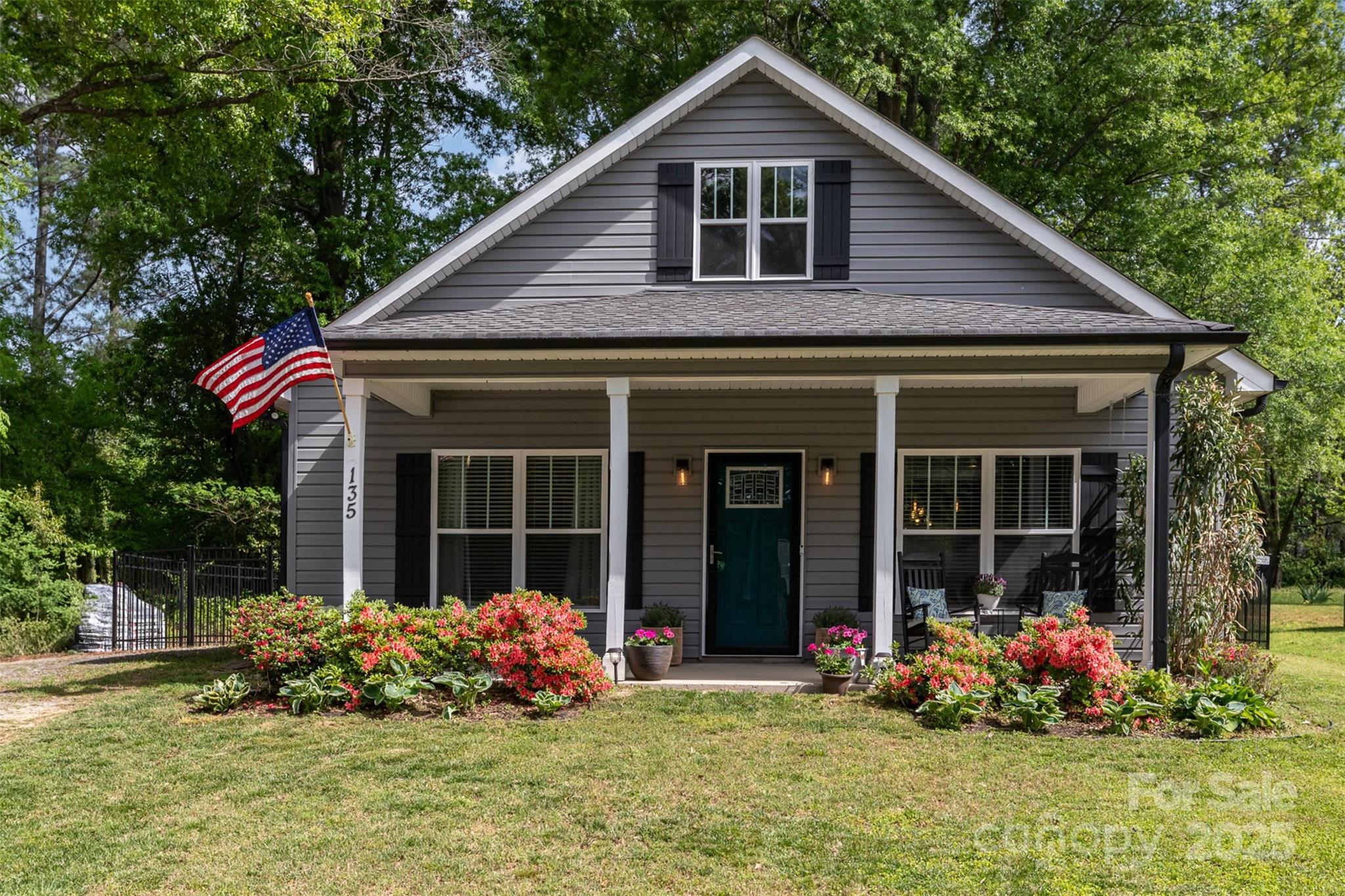 Charming 3BR/2BA Craftsman-style home in the heart of Rock Hill! This well-maintained home offers 1,286 sq ft of living space, an open floor plan with vaulted ceilings, vinyl plank flooring, and a custom shiplap fireplace wall. The kitchen features stainless steel appliances, an island with seating, and sleek countertops. Spacious primary suite with walk-in closet, dual vanity, and a beautifully tiled walk-in shower. Two additional bedrooms and a full bath offer flexibility for guests or a home office. Enjoy the outdoors on the covered front porch, back deck, and concrete patio—all within a fully fenced yard. Brand new roof in 2025! Located minutes from downtown Rock Hill, parks, dining, and I-77. This move-in ready home has it all!
