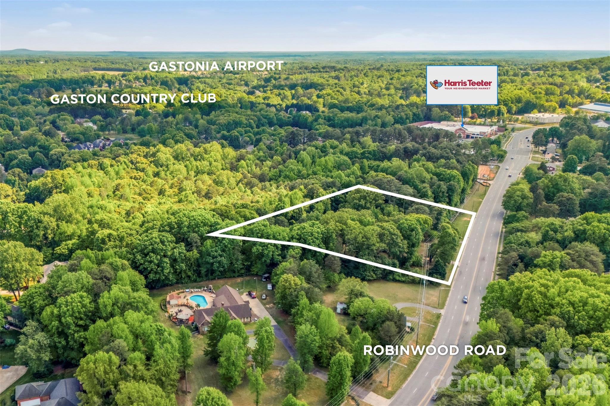 This iconic property has never been offered on the open market and has been family owned since 1966. 
3110 Robinwood Rd. has been Known throughout the years for its bright landscape, eye-catching flowers, and unforgettable presence along Robinwood Road, this is the property buyers have been waiting on for nearly 60+ years and now the family has decided to pass this one-of-a-kind property on to its next owner.
Situated on 2.24+ beautiful acres in one of the area’s most desirable locations with shops, grocery stores, Gaston Day School and less than a mile from Gaston Country Club, a top-rated school district, this property offers endless possibilities with exceptional road frontage and visibility. Once home to horses, the land still carries the charm and character of a strong presence. The property features a barn, gazebo, two sheds, and a former in-ground pool that has since been filled in. The opportunities here are truly unmatched:
Option 1: 
Enjoy the already existing 3,400+ sq. ft. custom-built home offering 4 bedrooms and 3.5 bathrooms, hardwood floors throughout, a spacious den converted from the original garage, central vacuum system, updated plumbing, partial encapsulated crawlspace, and a stunning fireplace crafted from 200-year-old brick imported from Charleston. This home is filled with timeless character, craftsmanship, and space ready for its next chapter.
Option 2:
The potential opportunity to subdivide the land and create a small patio home subdivision in this highly sought-after area or create a family compound.
Option 3: 
Investigate the potential opportunity for commercial rezoning, offering excellent exposure and future investment potential along highly traveled Robinwood Road with city sewer & water access.
Currently Zoned R-1 Single family residential, with any future plans would require approval by city council, and seller makes no representations or guarantees regarding subdivision or rezoning potential. 
Whether you are searching for a timeless estate property, future development opportunity, or investment potential, this extraordinary property with instant equity delivers a combination of history, acreage, charm, and possibilities that are hard to find. Priced to sell and will not last long!