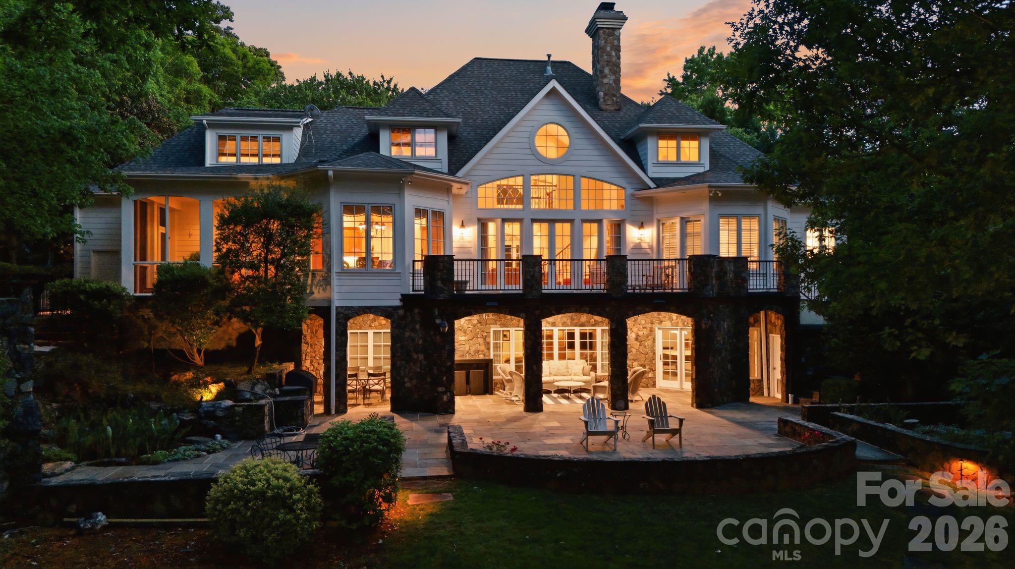 You are going to love our gorgeous luxury lake front custom estate built by renowned late builder Marion Grubb. Perfectly positioned with a circle driveway on the private 1.36 acre gently sloping lot to the waterfront! The multimillion-dollar long-range lake view will leave you speechless. No expense was spared in construction and design for both relaxation and entertainment. Inside, the home you'll find oversized crown molding throughout, beautiful next level finishes, a gorgeous FULLY renovated primary bath & closet! Have you ever owned a home where you had to wait forever on hot water?  Our circulating hot water system guarantees you won't have to wait! Love the idea of refreshing filtered clean water for your every day use? You'll love the whole house water filtration system!  The walk-out basement with a LIKE NEW sauna is PERFECT for entertaining w/ seamless access to the outdoors. The outdoor space is amazing—ideal for hosting gatherings while soaking in the serene waterfront setting. Listen to the waterfall water feature while perfecting steaks on your built-in grill. Whether you're seeking a full-time residence or a luxurious getaway, this property combines craftsmanship, location, and lifestyle in one extraordinary package. Preapproved buyers welcome!