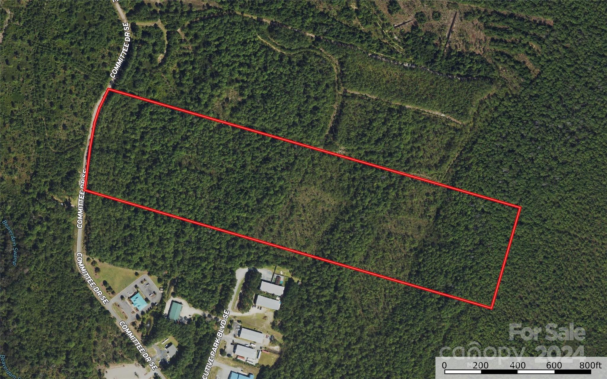 Prime commercial acreage at St. James/Southport for sale! This property is ideal for commercial development, located off of Highway 211(Southport-Supply Rd) at Committee Drive SE near the St. James Plantation entrance. Topography is level & wooded with over 500ft of road frontage! Municipal water & sewer available at the street. Property lies just outside of the city limits just minutes from Southport, St. James & Oak Island. Current Hwy 211 road widening will be complete around Fall 2026 resulting in 4-lane highway frontage & increased road visibility/traffic for this property. Property is located in an AE Flood Zone. Do not miss this incredible opportunity, contact Listing Agents for more information!