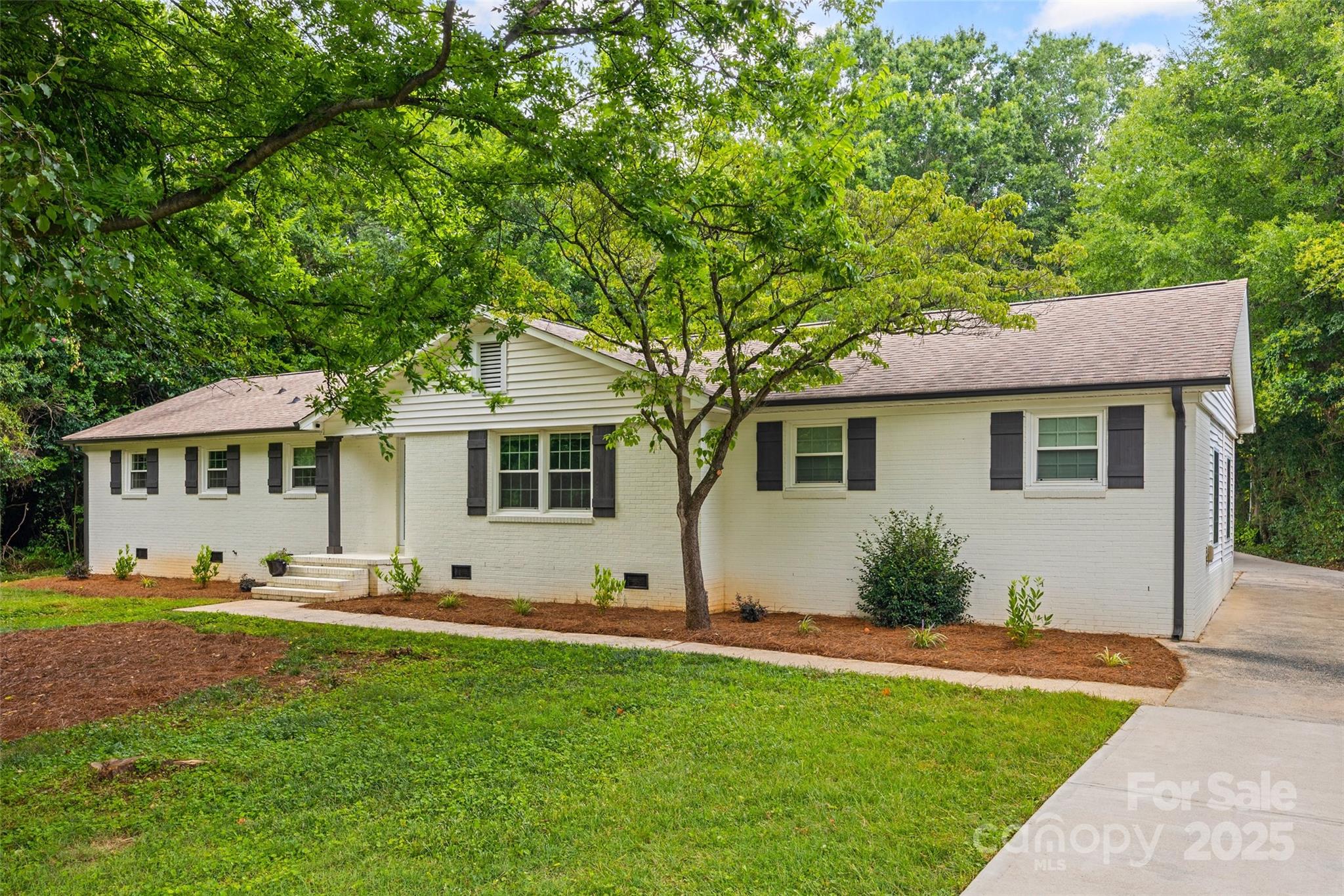 Back on the market with no fault of the seller. Home was through inspections and appraisal when unfortunate circumstances forced the buyer to terminate. Imagine owning an updated brick home on 1.28 acres with a 1500 sqft garage/shop located 15 minutes from downtown Charlotte. It almost seems to good to be true, but it’s not. This home is true brick construction that has been tastefully updated. The lot is private and gives the illusion of country living with mature hardwood and outdoor living space. You can bring all the toys as there is plenty of room to park RV’s, boats, ect. The detached garage/shop is 1500 sqft with high ceilings and heavy power. This is truly a one of a kind listing.