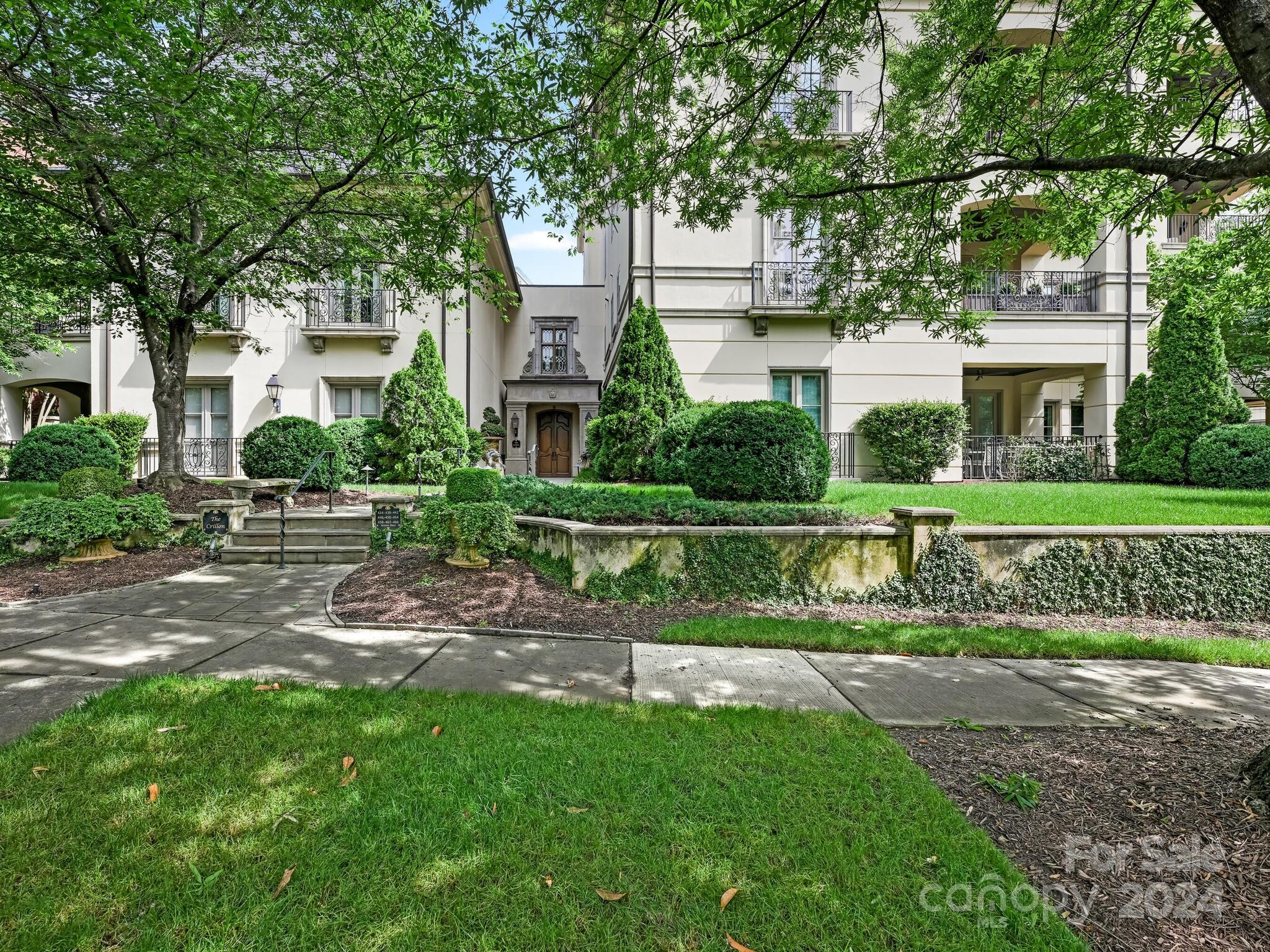 Beautiful Eastover Condominium that is well appointed with custom millwork, high ceilings, and spacious rooms. The French doors open to two separate terraces overlooking the private backyard and fountain. The Primary bedroom has complete privacy where the two Guest bedrooms are down the hallway. Primary Bedroom has french doors that lead to a patio overlooking the beautiful backyard. In addition to the spacious primary bathroom includes a large walk in closet with an additional closet. Beautiful formal Living and Dining Room, Kitchen, Breakfast area and Family Room are open to each other with a second terrace. Large Silver closet, each bedroom has their own bathroom, Laundry and Utility room located off the Kitchen. Unique building that has only 9 units, private backyard and secured underground parking.