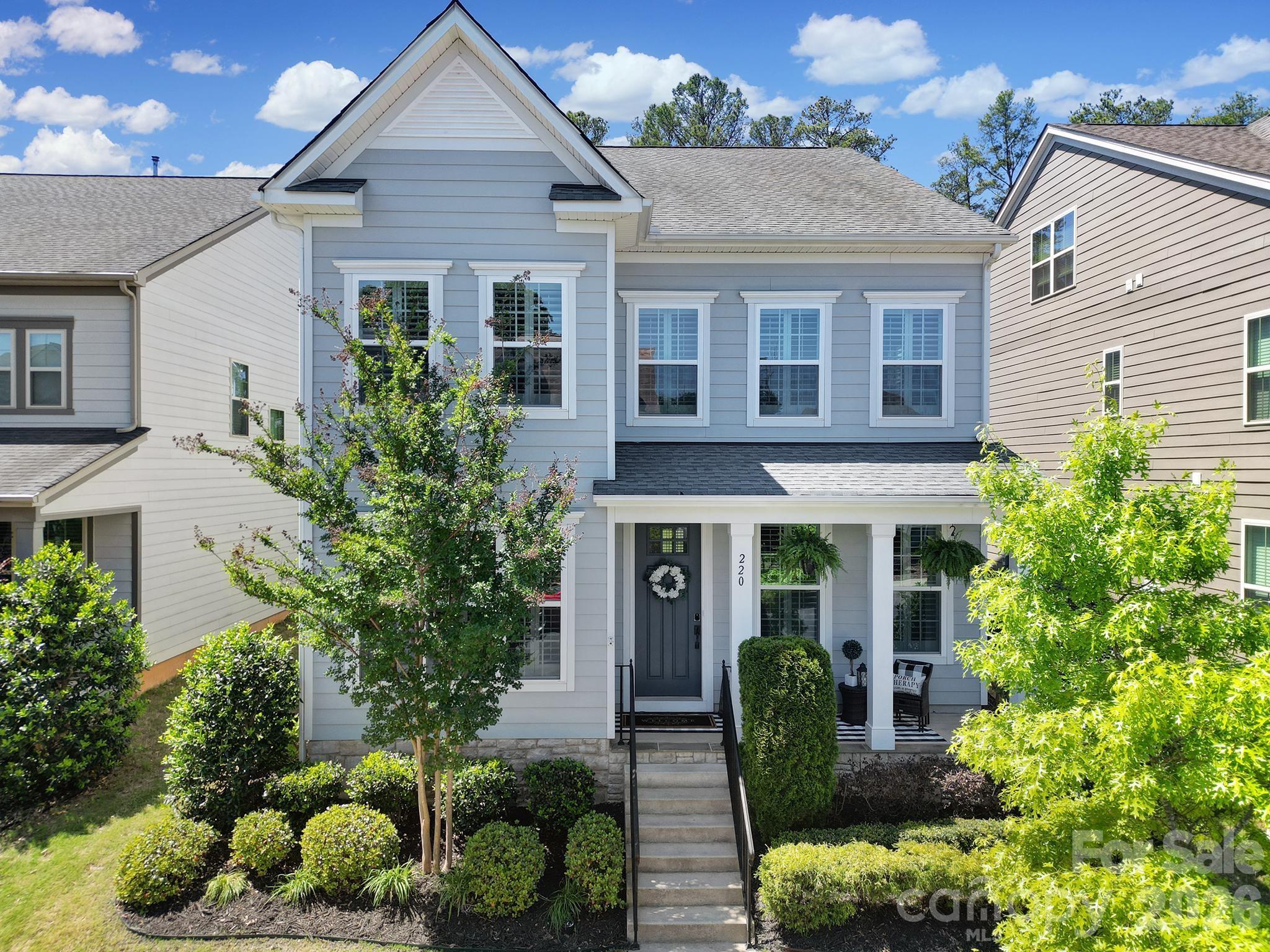 Open-concept living filled with natural light! The gourmet kitchen features an oversized granite island with ample seating, farmhouse sink, gas range, stainless steel appliances, and a walk-in pantry. The main level showcases beautiful upgraded 5” hardwood floors, a formal dining room, and a welcoming great room with a gas fireplace accented by detailed paneling. A bedroom with a full bath—currently used as an office—adds flexibility. 
Upstairs, you’ll find a spacious primary suite with a spa-like bathroom featuring a garden tub, tiled shower, and customized walk-in closet. Two additional bedrooms, a full bath, a generous loft with custom built in tv stand, and a laundry room complete the second level. 
Step outside to an extended outdoor living space featuring covered porch, extensive hardscaping, built in fire pit, and a fully fenced yard—ideal for entertaining, pets, or relaxing evenings at home. The home also features a 2-car garage.
Community amenities including a clubhouse, pool, playgrounds, ponds, and walking trails—all within walking distance to dining options. Located in the highly sought-after, award-winning Fort Mill school district.
