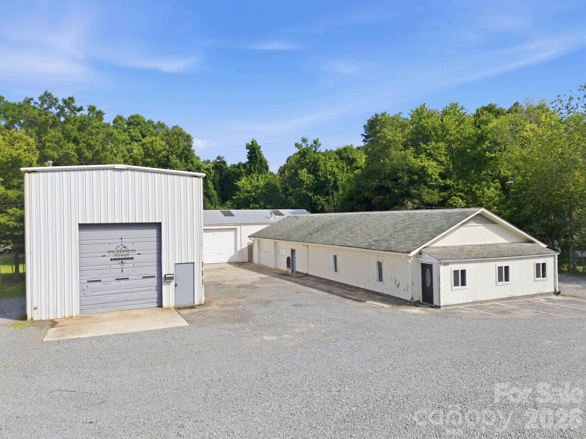Located in the growing Monroe commercial corridor, 1819 John Moore Road presents a unique opportunity to acquire an occupied commercial property featuring three buildings with established operational use and strong functionality for a variety of industrial, warehouse, contractor, flex, or service-oriented businesses. The property offers a versatile layout with multiple structures that can accommodate owner-users, investors, or multi-tenant configurations. Public commercial records reference approximately 6,400 square feet of warehouse/light industrial improvements with grade-level access and substantial operational utility.

The site benefits from convenient access to major transportation corridors throughout Union County and the greater Charlotte region, making it well-positioned for distribution, fabrication, storage, light manufacturing, or service operations. Existing occupancy provides immediate functionality and potential income-producing value, while the flexible configuration supports future business expansion or redevelopment opportunities.

Property Highlights:

Commercial property with three buildings
Functional industrial/flex layout
Excellent operational utility for contractors, warehouse, or service users
Convenient Monroe location with regional access
Multiple building configuration for flexibility and scalability
Potential owner-user or investment opportunity
Established commercial use in a growing market

The property’s strategic location in Monroe—one of the Charlotte region’s expanding commercial and industrial submarkets—offers long-term upside and continued demand for flexible commercial space.