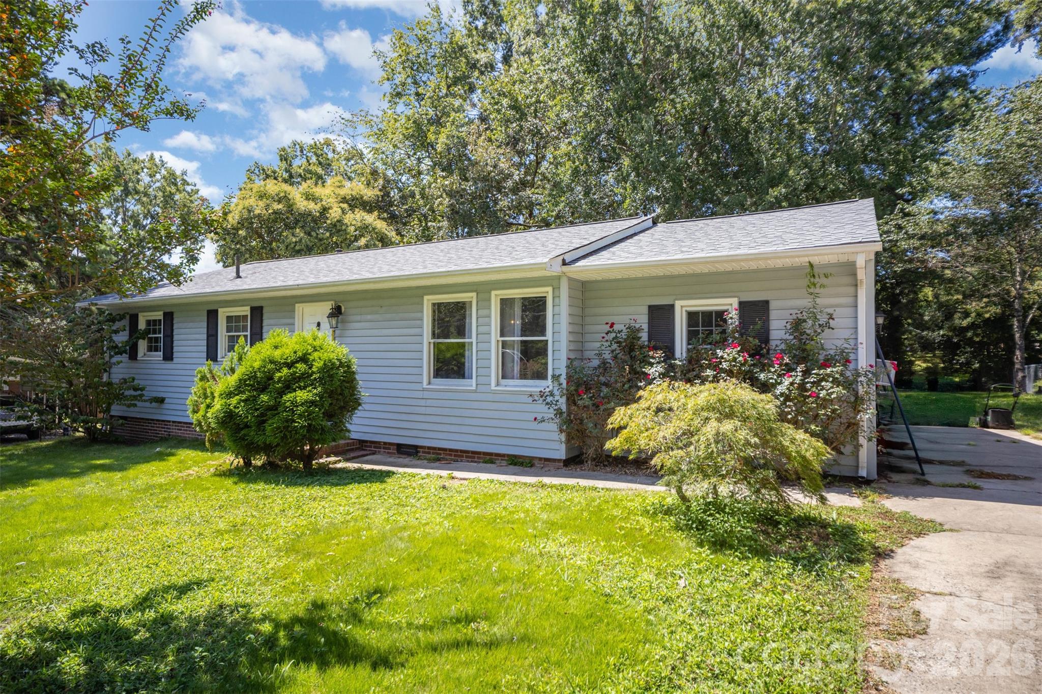 Short Sale Opportunity - Situated on a spacious, tree-filled lot in Mount Holly, this charming home offers a rare combination of yard space, privacy, and convenience. Set on nearly a third of an acre, the property is surrounded by mature trees that provide shade and a peaceful setting while still being just minutes from everything the area has to offer.
The home features a comfortable single-level layout with inviting living spaces and plenty of natural light throughout. A large living room and adjoining dining area create a welcoming place to gather, while the kitchen opens easily into the main living areas for everyday functionality. Additional flexible spaces within the home offer room for a den, office, or hobby area depending on your needs.
One of the standout features is the expansive backyard. The large lot offers endless possibilities with plenty of room for outdoor entertaining, gardening, pets, or future improvements. A deck off the back of the home provides a great place to relax and enjoy the surrounding greenery, while the open yard and mature trees create a quiet, park-like atmosphere.
Located just minutes from historic downtown Mount Holly, the home provides quick access to local restaurants, shops, parks, and community events. Outdoor enthusiasts will enjoy the close proximity to the U.S. National Whitewater Center and the charming town of Belmont, while nearby highways make commuting to Charlotte and surrounding areas simple. This property offers a great opportunity to enjoy a larger lot and peaceful setting while staying close to all the conveniences of the area.