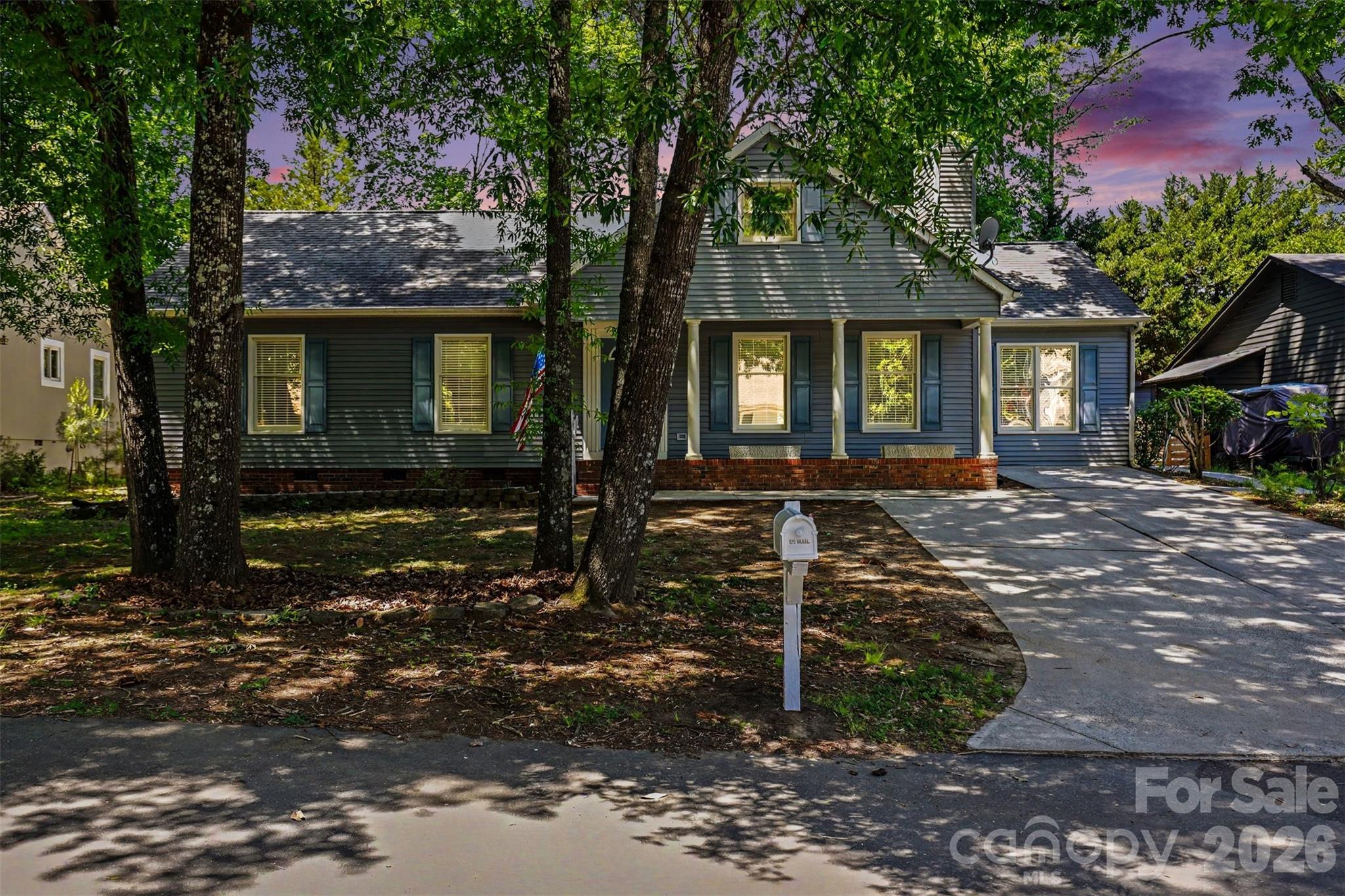 This beautifully updated ranch style home in sought after Tega Cay offers the ease of one-level living, paired with bright and open spaces. Hard to find 4 Bedroom Home that's Freshly Painted with a Renovated Kitchen! Tucked away on a quiet street, this home welcomes you with charming curb appeal and a covered front porch perfect for relaxing outdoors.

Inside, you’ll find over 2,060 square feet of thoughtfully designed living space featuring soaring ceilings, abundant natural light, and updated finishes throughout. The spacious living room is anchored by a stunning floor-to-ceiling stone fireplace and flows seamlessly into the dining area and kitchen, creating an ideal setup for both everyday living and entertaining.

The kitchen has been renovated with white cabinetry, stainless steel appliances, recessed lighting, generous counter space, and a large island with bar seating. A sunny breakfast area surrounded by windows creates the perfect spot for morning coffee or casual dining. Large sunroom provides flexible additional living space for a sitting room, office, playroom, or hobby area!

The oversized primary suite offers a spacious retreat with vaulted ceilings, dual closets, and an en-suite bath complete with a soaking tub. Three additional bedrooms provide flexibility for guests and work-from-home needs, all conveniently located on the main level.

Outside, the backyard offers privacy and room to enjoy the outdoors, while the detached storage building adds valuable extra storage space. Moisture barrier in the crawlspace. Fully fenced in back yard!

Conveniently located near shopping, dining, golf, parks, lake activities, and highly regarded schools, this move-in ready home combines location, space, and style in one of the area’s most established communities.