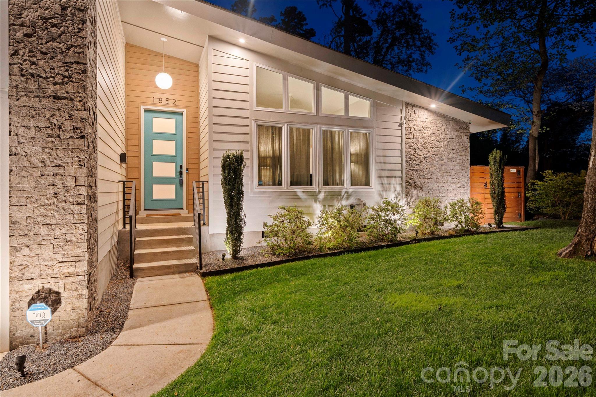 Charlotte’s Shannon Park welcomes you to this stunning 2,252 sq ft mid-century modern home where style meets comfort. Built in 2020, this thoughtfully designed residence is one of only five exclusive homes in the Usonia on Lakedell community. 
From the moment you arrive, you’ll notice the striking curb appeal with clean horizontal siding, warm stone accents, and a welcoming front porch. Inside, the open-concept layout features soaring ceilings, expansive windows, and abundant natural light throughout the main living spaces. 
The modern kitchen is built for both everyday living and entertaining, showcasing custom cabinetry, quartz countertops, tile backsplash, gas range, and a large island that flows seamlessly into the spacious living and dining areas. 
The primary suite provides a spacious retreat with a private ensuite, while two additional bedrooms offer flexibility for guests, family, or a home office. 
A spacious two-car garage adds convenience and extra storage.
Set on nearly half an acre, the property offers a large, fenced backyard with beautiful landscaping, exterior lighting, a rear deck, and patio—plus a smart irrigation system to keep the lawn lush year-round.
Ideally located just 2.5 miles east of Plaza Midwood off The Plaza, this home delivers modern design, functional living, and a prime Charlotte location all in one.