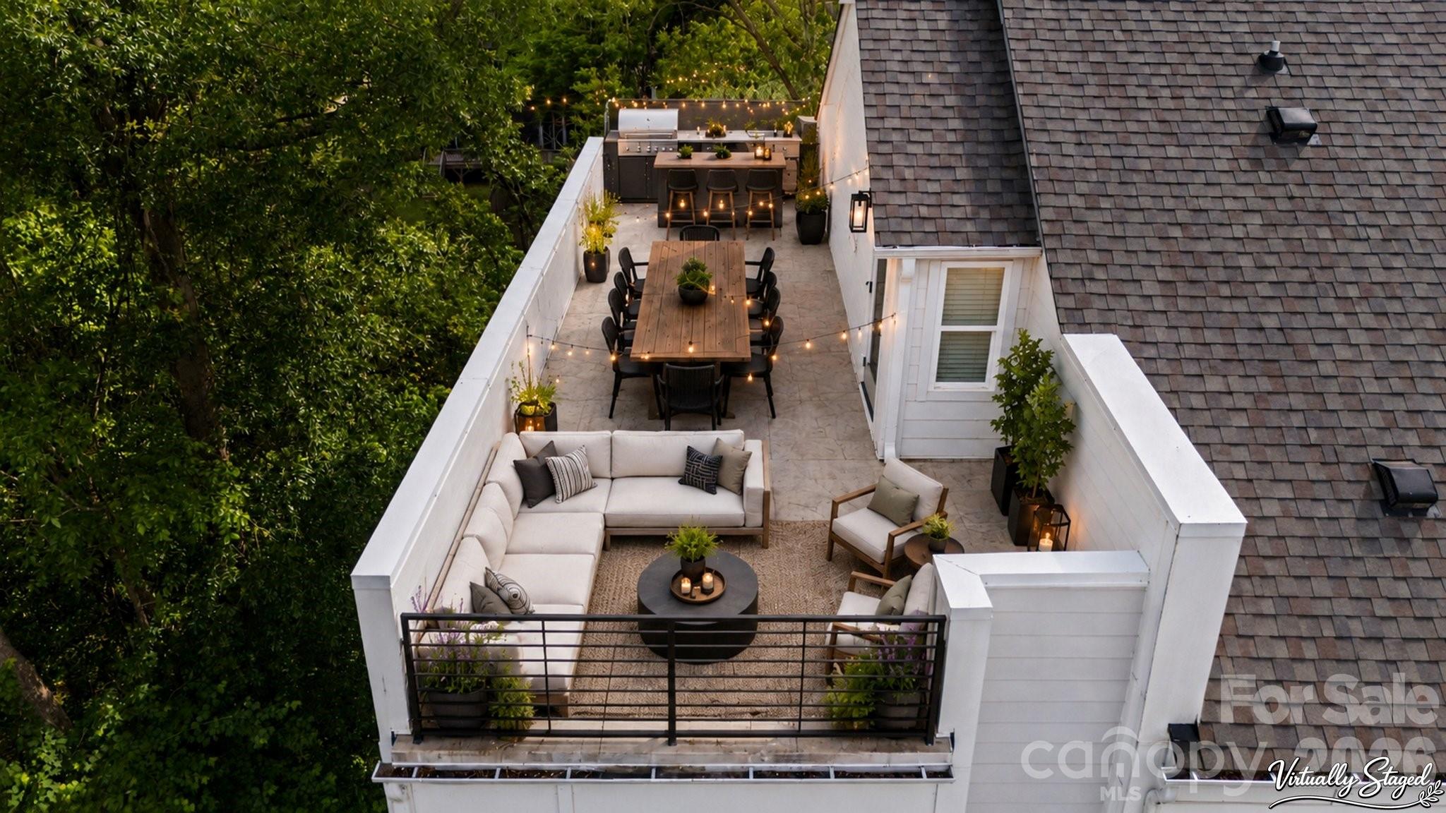RARE and UNIQUE end-unit townhome in LOSO Terraces featuring a full-width rooftop terrace spanning the entire top level—an exceptional outdoor living space not found in most homes in the community. Designed for entertaining, the rooftop is the perfect setting for sunset cocktails, outdoor dining, or relaxing under the open sky, all enhanced by a private setting tucked into a quiet, wooded corner with tree-lined views on two sides and positioned away from main roads and through traffic.
Ideally located in the heart of Lower South End (LoSo), this home offers true walkable urban living just steps from Olde Mecklenburg Brewery, Protagonist, Sugar Creek Brewing, Queen Park Social, Hive Fitness, Rally Pickleball, and more—plus approximately a 10-minute walk to the light rail station—while still enjoying a peaceful setting removed from road noise.
Inside, enjoy designer finishes including wide-plank hardwood floors throughout, white shaker-style cabinetry, upgraded quartz countertops, stainless steel appliances, and distinctive lighting. The light-filled end-unit positioning provides windows on three sides, creating abundant natural light and added privacy, along with a 2-car tandem garage with electric vehicle outlet.
Featuring 2 bedrooms and 2.5 baths, this is one of only a handful of this floorplan in the community and offers a rare opportunity to own a highly desirable layout that lives larger than its footprint—blending modern design, private, peaceful views, and a vibrant Lower South End lifestyle. Investors welcome—no rental restrictions.