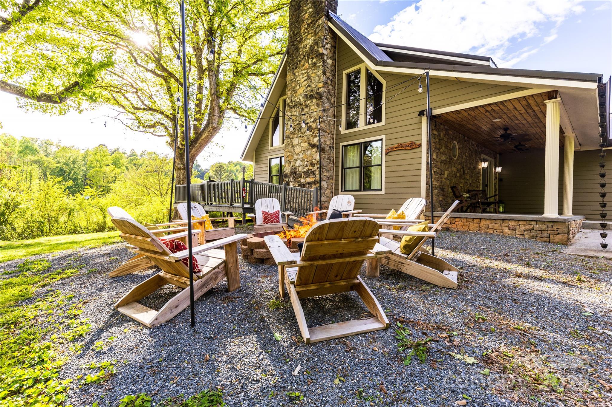 Experience modern mountain living at its finest in this beautifully designed 4-bedroom, 4-bath home in the heart of Bryson City. With fresh contemporary finishes, spacious living areas, and an ideal location, this property is perfect for full-time living, a vacation escape, or a high-performing investment—currently operating as a very successful short-term rental and offered with the option to purchase fully furnished and fully stocked.  

Inside, the open-concept layout showcases a striking wooden cathedral ceiling in the living room, clean modern lines, and thoughtfully curated design touches. Large windows flood the home with natural light throughout. Each bedroom offers comfort and privacy, including two first-floor primary suites with private en-suite baths. With four full bathrooms and generously sized bedrooms, the home easily accommodates up to 11 guests—ideal for multigenerational families or larger groups.

Step outside to a spacious deck with a hot tub, perfect for enjoying crisp mountain evenings or peaceful mornings among the trees. A charming second-level balcony offers an intimate spot for reading or relaxing, while the fire pit invites gatherings under star-filled skies. Endless outdoor adventures await just beyond your doorstep, with nearby hiking trails, waterfalls, and scenic overlooks.

The location is exceptional—just a short stroll from the beloved Polar Express train attraction. Bryson City is a welcoming mountain town at the gateway to the Great Smokies, complete with charming shops, friendly locals, and a Hallmark-movie atmosphere that enchants visitors year-round.

Blending modern style with rustic warmth, this serene retreat offers unforgettable mountain living and impressive rental potential. Don’t miss the opportunity to own a remarkable getaway in one of the Smokies’ most desirable destinations.

Unlock the potential for nearly 1,200 sq ft of additional finished living or recreational space by transforming both the garage and the basement. Although these areas are not adjacent, each presents its own valuable opportunity to expand the home’s livable footprint. The basement already features a mini-split system for airt conditioning, generous ceiling height, and exterior access—making it an ideal candidate for a playroom, home theater, gym, office, and more. The above-grade garage can also be finished to create additional living space or even converted into another bedroom. The possibilities are endless!

PS: Drive by but do not drive up the driveway, as the property is an active vacation rental and guests cannot be disturbed. Thank you!