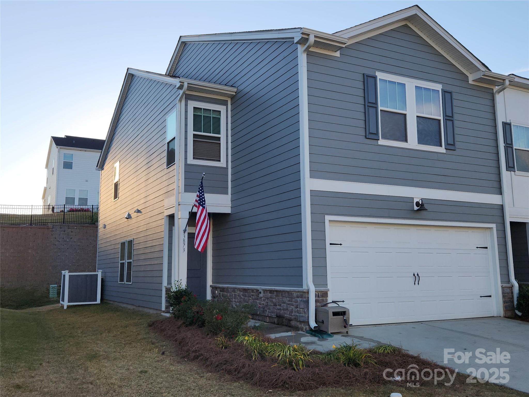 Beautifully maintained townhome with spacious open floor plan. Home is only 2 years old and it shows.  Kitchen has gorgeous cabinets and large island for cooking or entertaining. Kitchen opens to great room and large dining area. The main level has plenty of light and the sliding door takes you to great outdoor space.  Upstairs does not disappoint; Large loft provides a separate entertainment or office area.  The owner suite is very spacious with plenty of outside light. 2 more bedrooms upstairs with a Jack and Jill Full Bathroom. This home feels brand new and offers the hard to find end unit with a 2 car garage.  Great location to shopping and highways.
