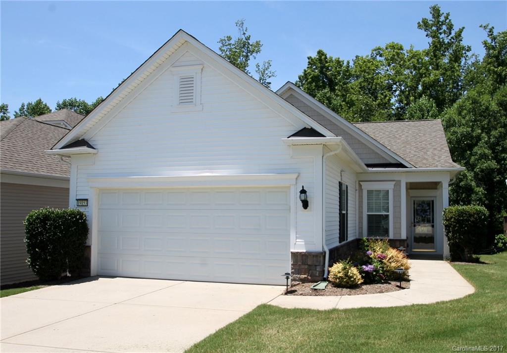 This charming Brookside is situated on a nice lot with a lovely wooded view. It's the perfect location for easy access to  shopping, dining, The Lake House, Golf Clubhouse and more. Great room with sliding glass doors offers plenty of natural light & gorgeous wooded views, while also providing access to the back deck to create the perfect entertaining space. Come experience the active adult lifestyle in Sun City Carolina Lakes. Age 55+ with fabulous resort-style amenities.