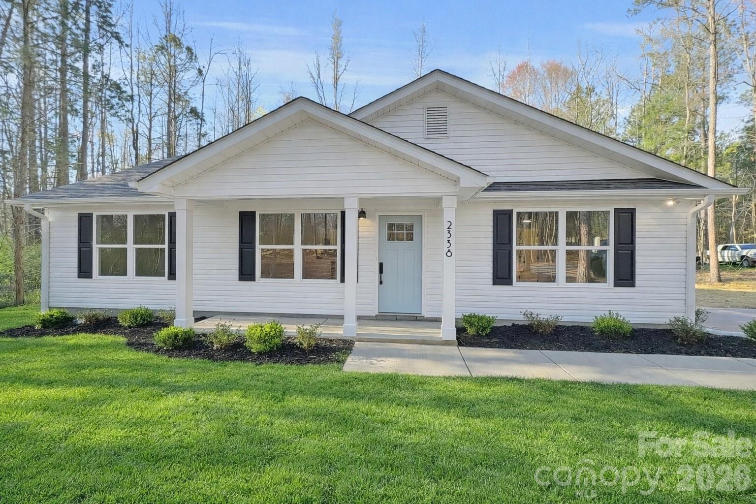 Rare opportunity for a brand new ranch home on 1.24 private wooded acres in the Buford School District with vaulted ceilings, quartz counters, an open-concept layout, and no HOA.

Welcome to 2338 Neill Rd, a beautifully designed home offering privacy, modern finishes, and a highly functional layout. Situated on a 1.24-acre wooded lot, this property provides the perfect blend of peaceful country living with space to enjoy the outdoors.

Inside, the split-bedroom floor plan offers both privacy and comfort, while the open-concept living area seamlessly connects the kitchen, dining area, and living room. Vaulted ceilings create a bright, spacious feel, and laminate flooring throughout the home adds both durability and style.

The kitchen features white soft close cabinetry and bright quartz countertops, with the same quartz finishes continuing into the bathrooms for a clean, modern touch.

Step outside and enjoy the space and privacy of your 1.24-acre wooded lot, offering room to relax, play, or simply enjoy the quiet surroundings.

If you’re looking for modern finishes, an open layout, and room to spread out in the highly sought-after Buford School District, this home checks all the boxes