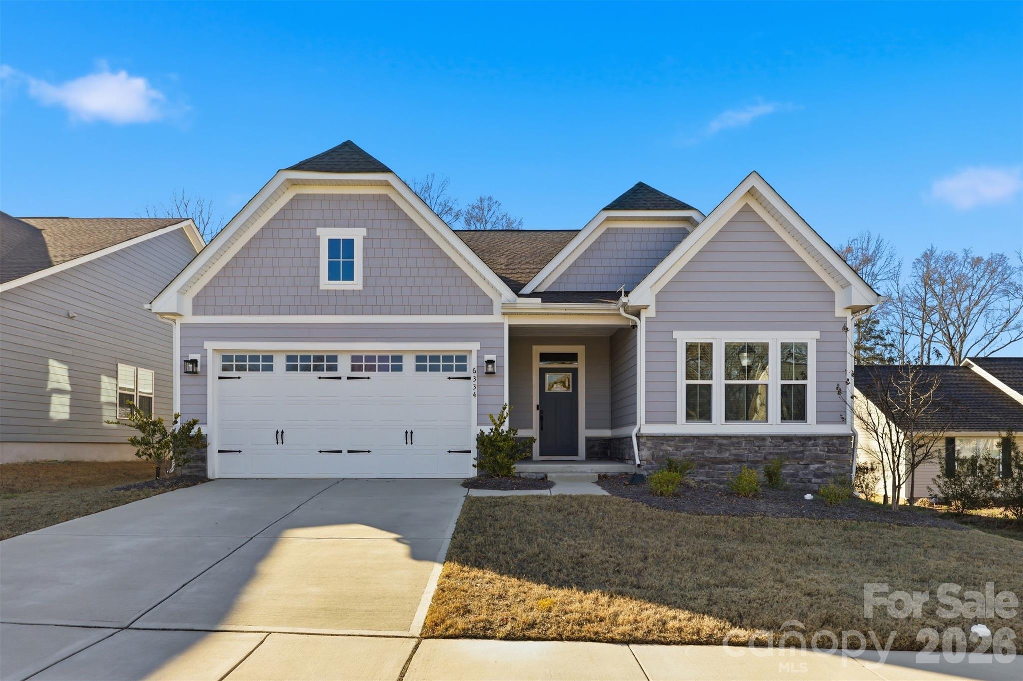 Nestled in one of Harrisburg’s most sought-after communities, this charming home offers unbeatable convenience — just a short walk to the town center and easy access to Hwy 49 and 485. The open floor plan flows beautifully, with a spacious kitchen and dining area that opens into a bright living room overlooking a lovely backyard. The kitchen is appointed with quartz countertops and stainless steel appliances. Retreat to the generous owner’s suite, complete with an elegant trey ceiling and serene backyard views. The en-suite bath is a true sanctuary, boasting a dual-sink vanity, oversized shower, dedicated linen closet, and an impressive walk-in closet. Washer and dryer are included, and lawn maintenance is covered by the HOA — making this a truly low-maintenance lifestyle. Don’t miss this one!