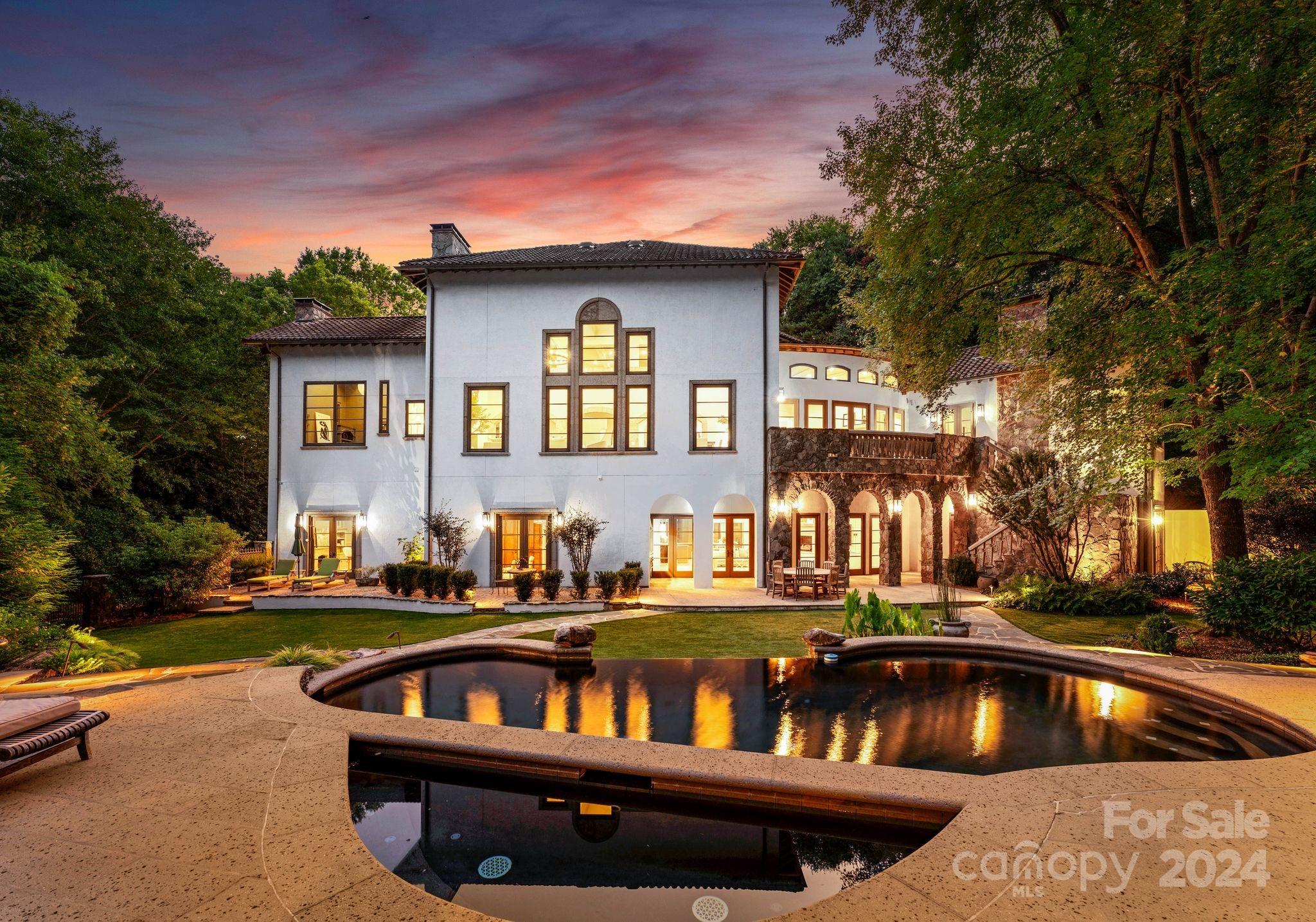 Welcome to 5403 Gorham Drive, a masterpiece of elegance and craftsmanship. This exquisite home features a timeless Hard Coat Stucco and Stone exterior, complemented by a Lifetime Tile Roof and elegant copper accents. The lushly landscaped grounds offer a private retreat with a vanishing edge pool, custom pergola, built-in gas grill station, & extensive outdoor lighting. Inside, the 8” Walnut Plank Floors & custom brickwork create a sophisticated ambiance, while the Great Room’s 20’ ceilings add grandeur. The chef's kitchen is a culinary delight with Wolf appliances, Sub-Zero refrigeration, and Calcutta Marble countertops. The upper level showcases suites with reclaimed wood beam ceilings and luxurious ensuite baths. The lower level impresses with a home gym, a 1,200-bottle wine cellar, a second office with a gas fireplace, and a lavish guest suite. With its unparalleled blend of elegance and functionality, this residence stands as a true testament to refined luxury living.