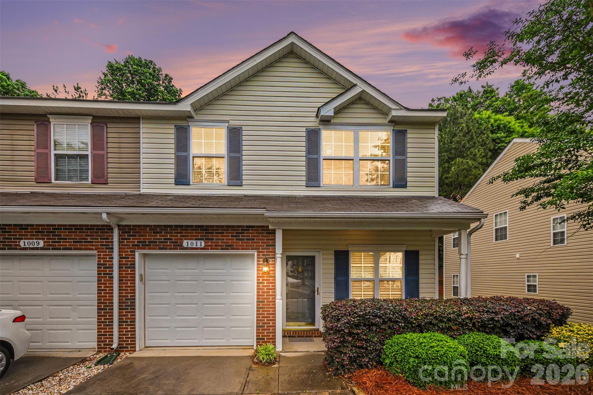 Tucked away on a quiet back street of the community, this well-maintained end-unit offers both privacy and convenience. A welcoming open foyer leads into a spacious family room featuring cozy gas logs and serene views of the private backyard.
The galley-style kitchen is equipped with full appliances and upgraded 42” cabinetry, providing both functionality and style. Upstairs, you’ll find two versatile loft areas—perfect for a potential third bedroom, home office, or flexible living spaces to suit your needs.
Generously sized bedrooms, ample closet space, two full bathrooms, and a dedicated laundry room complete the upper level. Outdoor living is just as inviting with a concrete patio, charming front porch, and privacy fencing