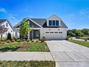 This luxury Promenade floor plan features a  2nd floor bonus room,  grand foyer entrance, open layout. Luxurious amenities, such as Deluxe Kitchen with 42" cabinets, 30" Built-in Combination Convection Microwave / Wall Oven. Private den with Barn Doors, spacious Primary Suite with zero threshold universal shower with bench and transom window.  Ample storage space, and a flexible bonus suite that can serve as a guest room.  The Courtyards on Robinson Church is your premier 55+ active lifestyle community, with 4 community parks, walking trails, salt water pool and club house.  This 77 home boutique neighbor is designed to offer the perfect blend of comfort, luxury, and low-maintenances living.