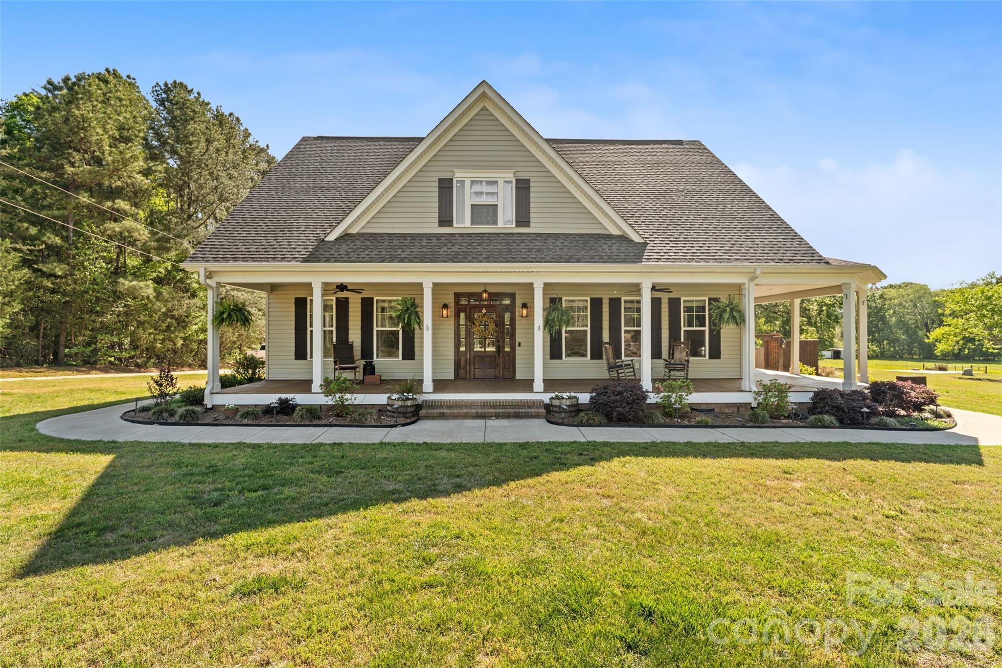 Welcome to your own 2.05-acre slice of paradise in the established Bel Air Acres community. From the moment you step onto the massive front porch, it is clear this 2019-built home was designed for a life well-lived. The open floorplan feels spacious and inviting, anchored by a living room with elegant coffered ceilings and a gas log fireplace. The kitchen is a true centerpiece that opens directly to the dining area, featuring a large work island with a breakfast bar, a gas range, and a walk-in pantry. The main-level primary suite offers a private escape, complete with a free-standing soaking tub, a tiled shower, and a walk-in closet that conveniently connects to the large laundry room. With five bedrooms and an additional 641 square feet of walk-up attic space above the side-load garage, there is no shortage of room to grow. Outside, the backyard is a destination of its own. Relax on the covered rear porch or jump into the fenced in-ground pool, which features a sun ledge and a cascading hot tub. Plus, the dedicated half bath with easy pool access means fewer wet footprints through the house and more time enjoying the water.