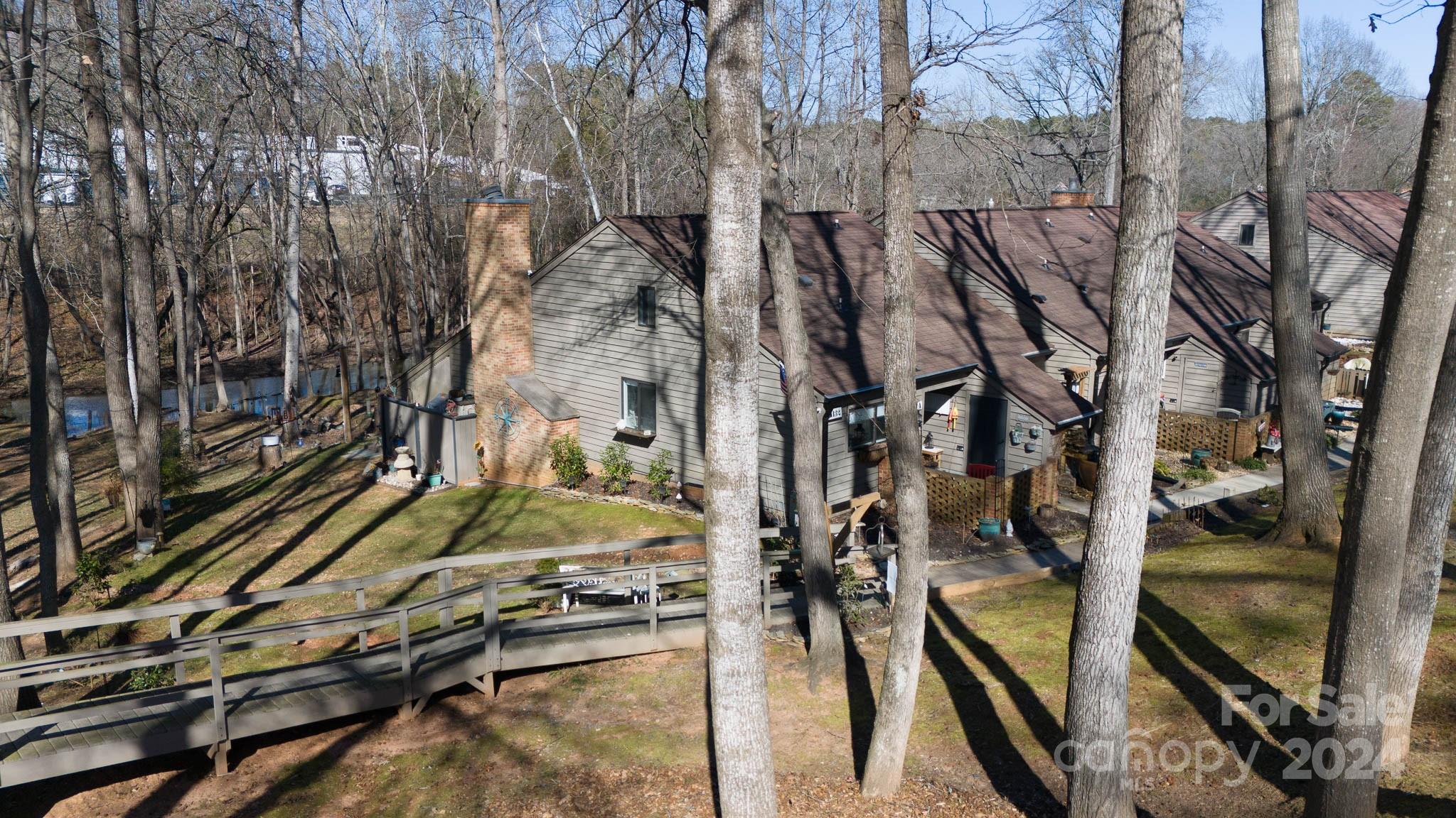 Located in the Heart of Lake Wylie!  This gorgeous home waits for new owners to enjoy the Lake Life! Beautiful updates with all new flooring, lights and fresh paint throughout.  HVAC, appliances and fireplace insert (propane) are newer.  3rd bedroom loft.  A front porch patio with storage room for all your lake items.  HOA covers outside maintenance, community pool plus trash, water and sewer. Easy access for canoes and kayaks right outside the back door. The community offers 2 complimentary boat slips that you can use for the day so you can have friends stop by and scoop you up or run by the house to pick up some more supplies. Boat slips can be purchased when available.  Enjoy the water and fish right outside your backdoor.  Convenient to all of Lake Wylie's awesome amenities!