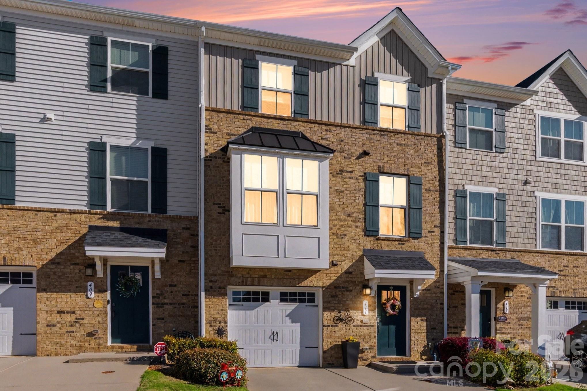 From the moment you walk in, this beautifully upgraded townhome in Grantham Place feels like home. Sunlight fills the open-concept main level, highlighting the stylish luxury vinyl plank flooring and warm, neutral tones that create a space both inviting and versatile. The heart of the home is the kitchen—designed for connection and everyday moments. With granite countertops, stainless steel appliances, a gas cooktop oven, and upgraded cabinetry, it’s the perfect place to cook, gather, and entertain. The seamless flow into the living and dining areas makes hosting effortless, whether it’s a quiet night in or a full house of friends and family. Upstairs, the primary suite offers a peaceful retreat at the end of the day, complete with a walk-in closet and a spa-inspired bath featuring dual vanities and a sleek walk-in shower. Two additional bedrooms provide flexibility for whatever life needs—guest space, a home office, or a creative studio. Downstairs, the finished lower level opens up even more possibilities. Imagine movie nights, a home gym, or a playroom—this space adapts to your lifestyle. Step outside to your private patio, a perfect spot for morning coffee or unwinding in the evening. Located in the highly rated Fort Mill School District and just minutes from shopping, dining, and major highways, this home offers not just convenience—but a lifestyle. If you’ve been waiting for a home that combines style, comfort, and flexibility, this is the one.