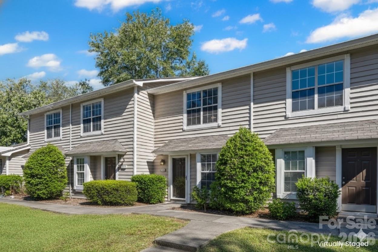 This spacious two-story home offers generous living space and a well-designed layout. Upstairs, you'll find two comfortable bedrooms and 1.5 bathrooms for added convenience. Neutral finishes throughout provide a versatile backdrop, perfect for easy customization to suit your style. The kitchen features granite countertops and a pass-through kitchen. Step outside to a private, fenced concrete yard with a storage room—perfect for relaxation and outdoor enjoyment. Enjoy access to the Regent Park community pool, playground, walking trails, basketball and tennis courts. This townhouse is in the award winning Fort Mill School district and conveniently located near major highways, shopping and dining.