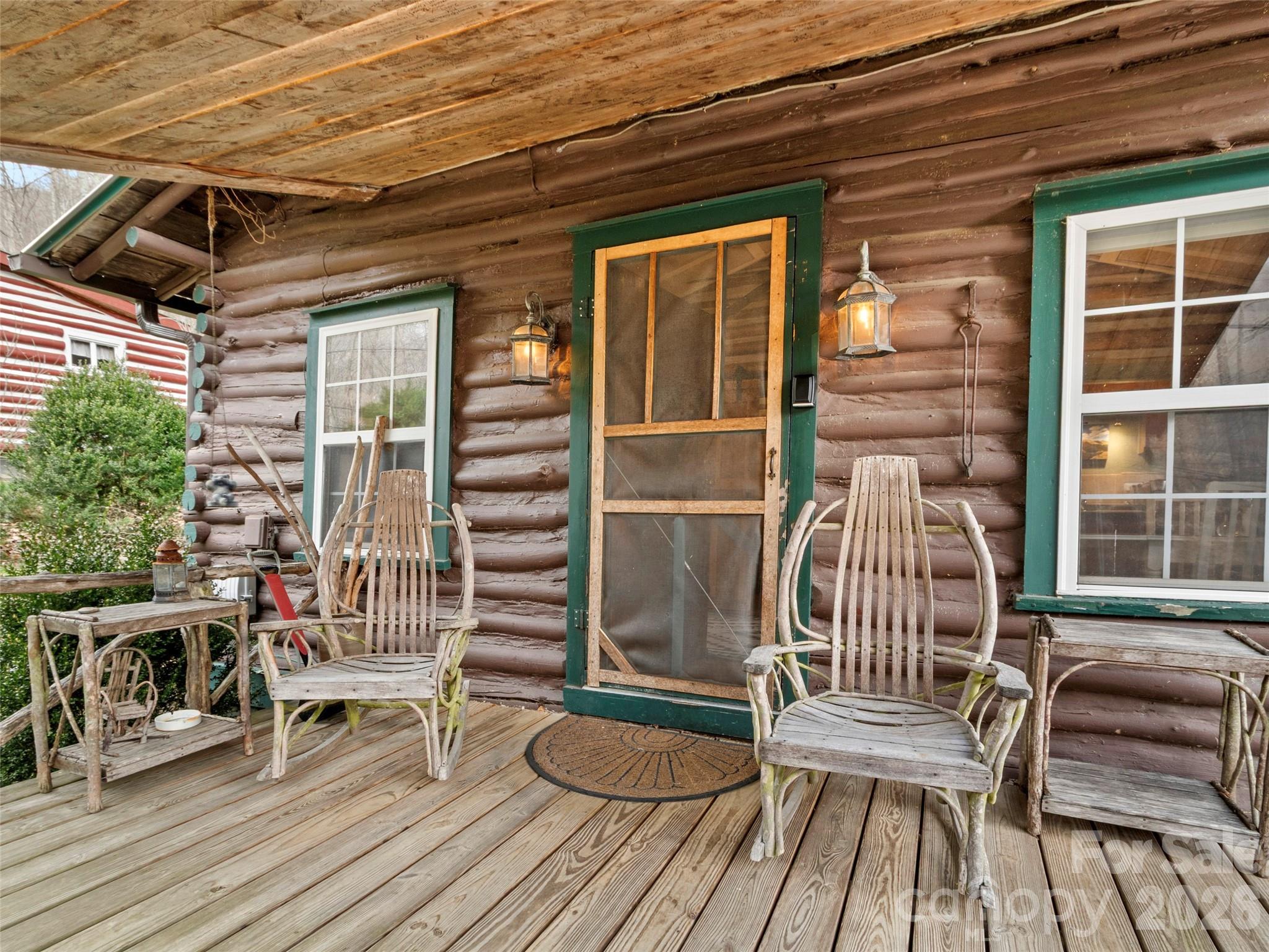 This log home built in 1936 radiates character & historical charm at every turn. Situated on a 1.49-acre lot the home is defined by its coveted Cattail Creek frontage where the soothing sounds of rushing water provides a constant natural soundtrack. The exterior features a spacious covered front porch perfect for quiet mornings & covered pavilion w/an open deck by the creek. This outdoor oasis serves as an ideal space for relaxing or entertaining while overlooking the picturesque creek & lush mountain landscape. The interior of the home continues to enchant w/its authentic log construction, vaulted ceilings & cozy floor plan. The home's atmosphere is anchored by craftsmanship that highlights the home's vintage appeal while modern essentials like high speed internet ensure you stay connected. Currently operating as a successful short-term rental this property offers versatility whether you are seeking an investment opportunity or a private mountain getaway. The Cattail Creek community provides easy access to outdoor recreation & the surrounding beauty of the Blue Ridge mountains. A rare opportunity to own your very own mountain cabin by the creek!