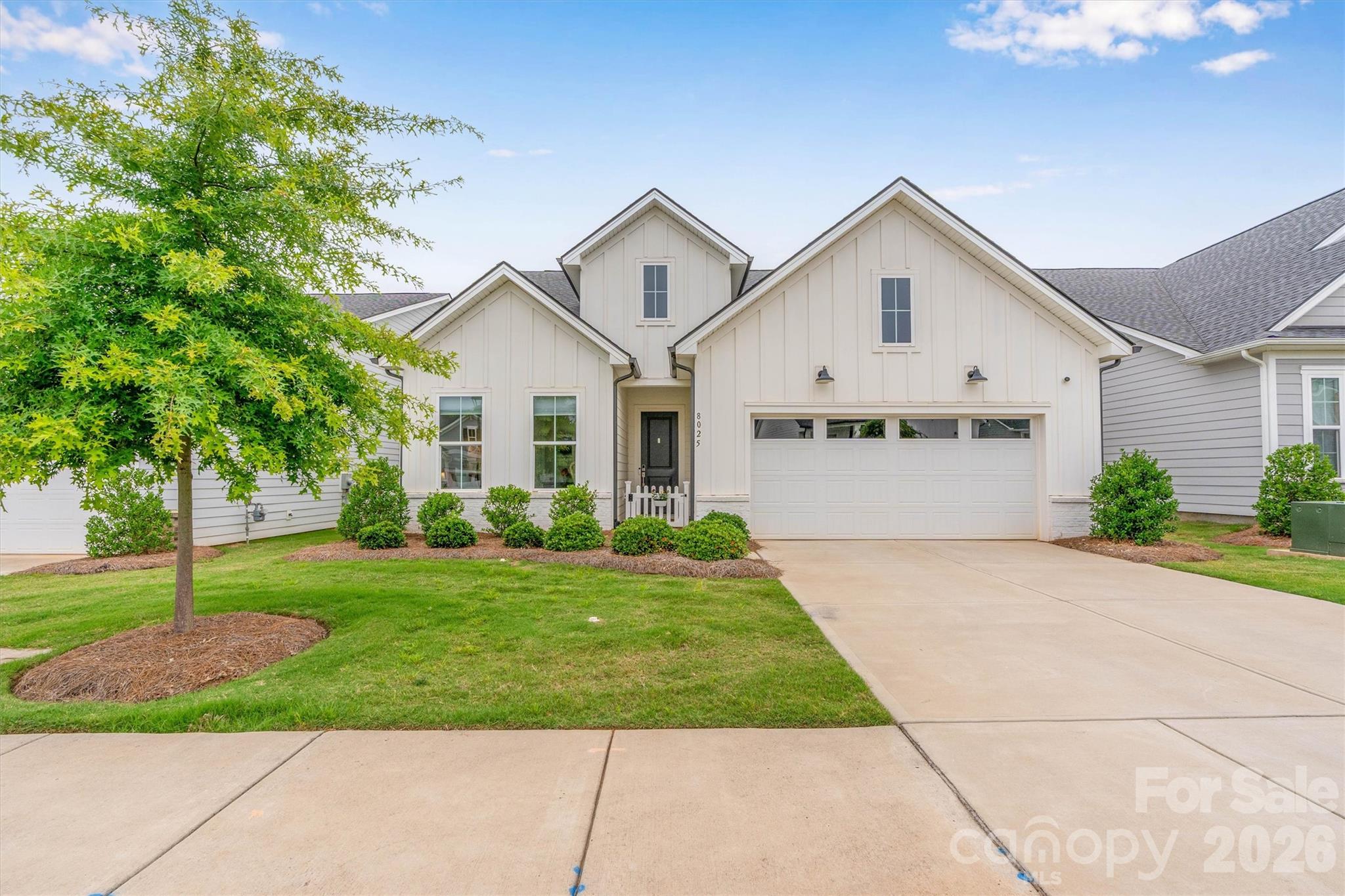 YOU DON'T WANT TO MISS THIS ONE! Stunning "Dilworth Modern Farmhouse" in the resort-style community of Griffith Lakes by Toll Brothers. This 2 Bed, 2 Bath home with Flex/Office shines with LVP floors, crown molding, upgraded lighting and custom window treatments. Beautifully appointed Kitchen w/Gas cooktop, wall ovens and tile backsplash, enhanced by a custom Butler's Pantry/Coffee Bar with Quartz countertops, offering additional storage, prep space, and a stylish area for entertaining. The luxury Primary Suite features a "spa-like" ensuite bath, while the Guest Bath enjoys an upgraded walk-in shower. Seamlessly blend indoor/outdoor living with the panoramic stacking glass doors opening to a screened Lanai with "picture screens"  and a custom privacy screen/shade, looking out over a beautiful flower garden on a large, level lot (plunge pools are allowed in community w/approval). Includes an oversized 2-car garage, all appliances (W & D Included!), energy-efficient Low-E windows and low-maintenance fiber-cement construction.  Enjoy unbeatable community amenities: a 17-acre lake with a kayak launch, a clubhouse, fitness center, an outdoor pool with cabanas, playground, tennis, and 6 pickleball courts - all with quick access to I-77/I-85/I-485! PLUS, the Red Line Commuter Rail was recently approved with a planned rail stop at Harris Station.