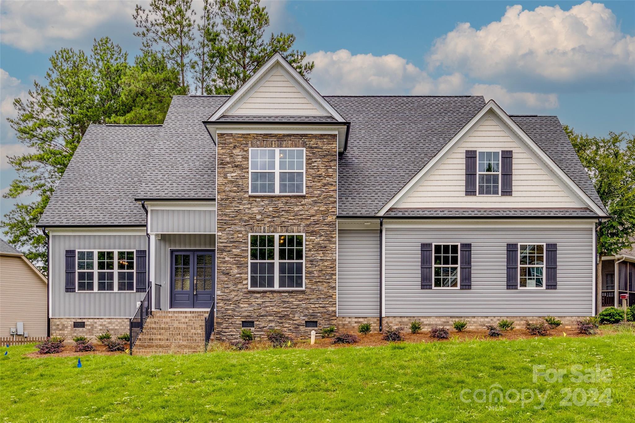 This stunning new construction home offers 4 bedrooms and 3 bathrooms, all dressed to the nines with high-end finishes in the sought-after Seven Oaks Subdivision. The spacious open floor plan features an array of ceiling designs, including coffered, vaulted, and tray ceilings, adding a touch of elegance and sophistication. The beautiful kitchen is a chef's dream, boasting a work island, quartz countertops, a custom gas range, and a pantry for all your culinary needs. The main living areas are adorned with luxury vinyl tile, combining durability with a sleek, elegant appearance. Primary bedroom on the main. Conveniently located just minutes from a diverse selection of dining, shopping, and recreational options, as well as I-77 for easy commuting. Enjoy fantastic community amenities including a clubhouse, pool, sidewalks, and streetlights. This home is a perfect blend of luxury, comfort, and convenience.