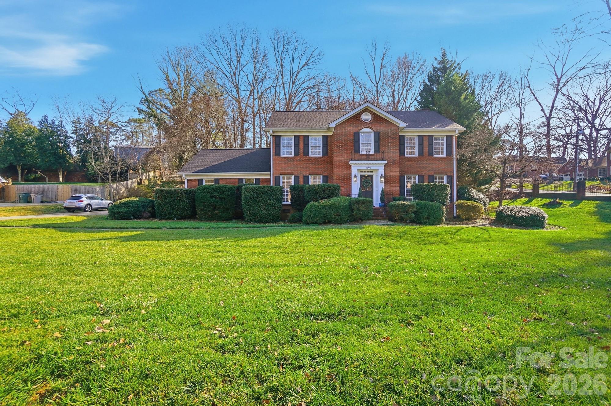 Now offered at $449,000, this spacious 4-bedroom, 2.5-bath full-brick Colonial offers approximately 3,300 square feet on a generous .46-acre corner lot in the established Sherwood Forest community — a mature neighborhood with no HOA.

At this price point, this home represents an exceptional opportunity for buyers seeking space, character, flexibility, and value that is increasingly difficult to find in today’s market.

If you’ve been comparing newer construction, this home offers something different — larger living spaces, timeless character, mature landscaping, and a well-established setting without the restrictions of an HOA.

Designed for both everyday living and entertaining, the main level features multiple living areas including a formal living room, dining room, den with fireplace, and an inviting all-season sunporch that creates seamless indoor-outdoor flow. Crown molding and wide-plank hardwood floors add warmth and architectural appeal throughout.

The kitchen offers granite countertops, ample cabinetry, and a functional layout designed for connection and efficiency. Upstairs, all four bedrooms are generously sized with excellent closet space, including a comfortable primary suite. Updated bathrooms blend modern finishes with classic style.

A finished bonus room above the garage provides exceptional flexibility and is ideal for multigenerational living, guest accommodations, a home office, or media space.

The backyard features a natural, landscaped setting with mature crepe myrtle trees and a gently sloped design, offering a more private, low-maintenance outdoor environment. Ideal for buyers who prioritize interior space, flexibility, and overall value over a traditional flat yard.

Additional highlights include a new roof (2025), main-level laundry, washer and dryer included, and an attached two-car garage.

Seller is now offering $3,000 in buyer flex cash with an acceptable offer, which may be used toward buyer closing costs, prepaid expenses, or interest rate buy-down, subject to lender approval.

Move-in ready and available for a quick closing, this is one of the strongest values for a full-brick home of this size currently available in the area. Conveniently located with easy access to Belmont, Charlotte, shopping, dining, and major roadways.