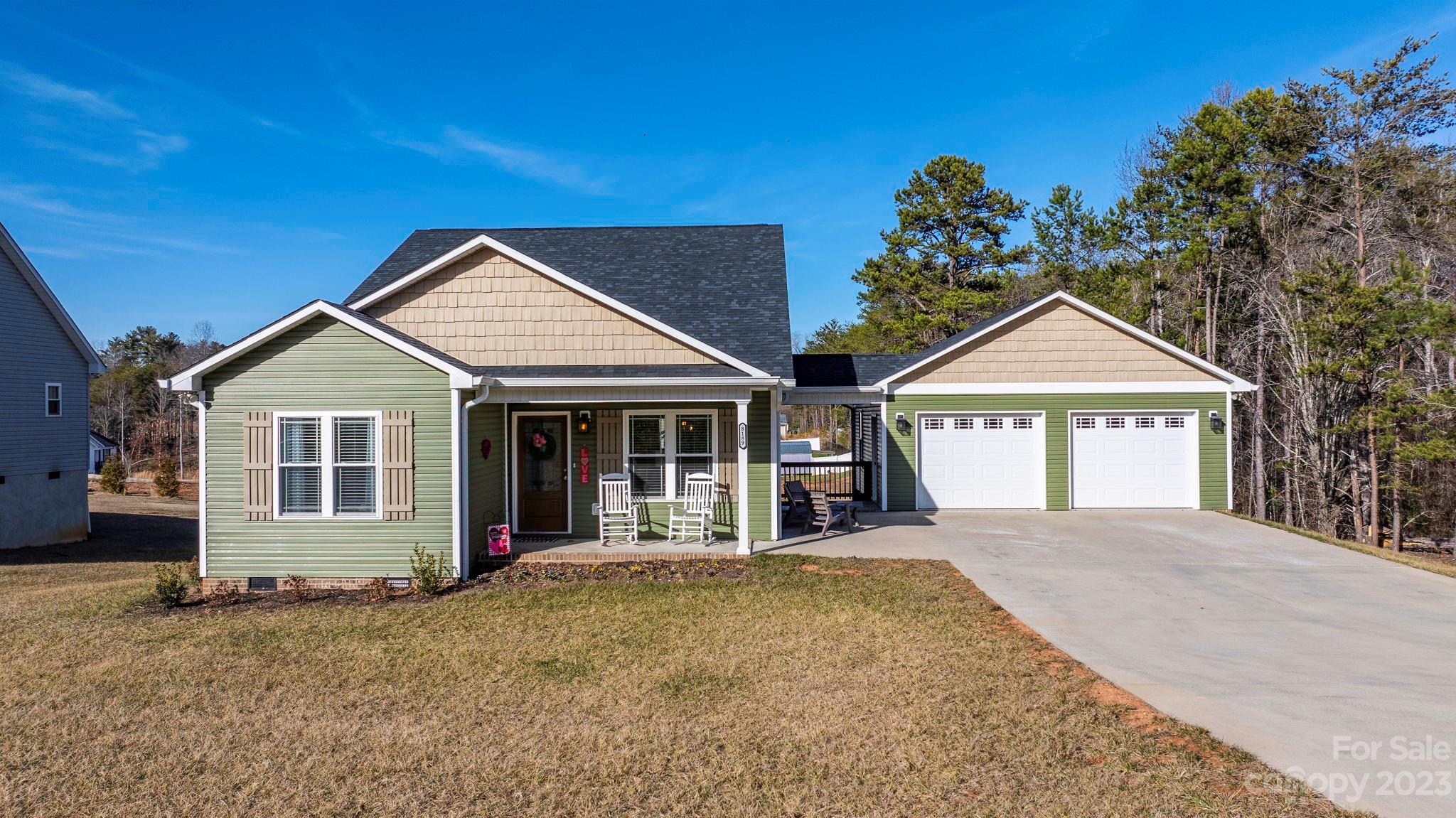 Beautiful custom built home with detached garage connected by an open-breezeway! Built in 2019! Home is extremely accessible with double doors opening up to the driveway; just a few yards away from the two car detached garage. Entering this home you're greeted by a spacious open-plan living area. A smooth transition from living room to dining area into the kitchen creates a great space to entertain guests. Natural light flows in to large windows throughout the house. Kitchen includes samsung black stainless appliances (refrigerator, dishwasher, microwave, and oven with a stove top). Through the primary bedroom and on-suite bath there is a flex-space that has been used as a nursery in the past but could be an office, extra-closet, storage, etc..On-suite bath features double vanity and a stunning shower. Rear of the home also features a screened in porch with staircase access to the backyard and crawl space entrance. Crawl space includes slab to park lawnmower or other small equipment.