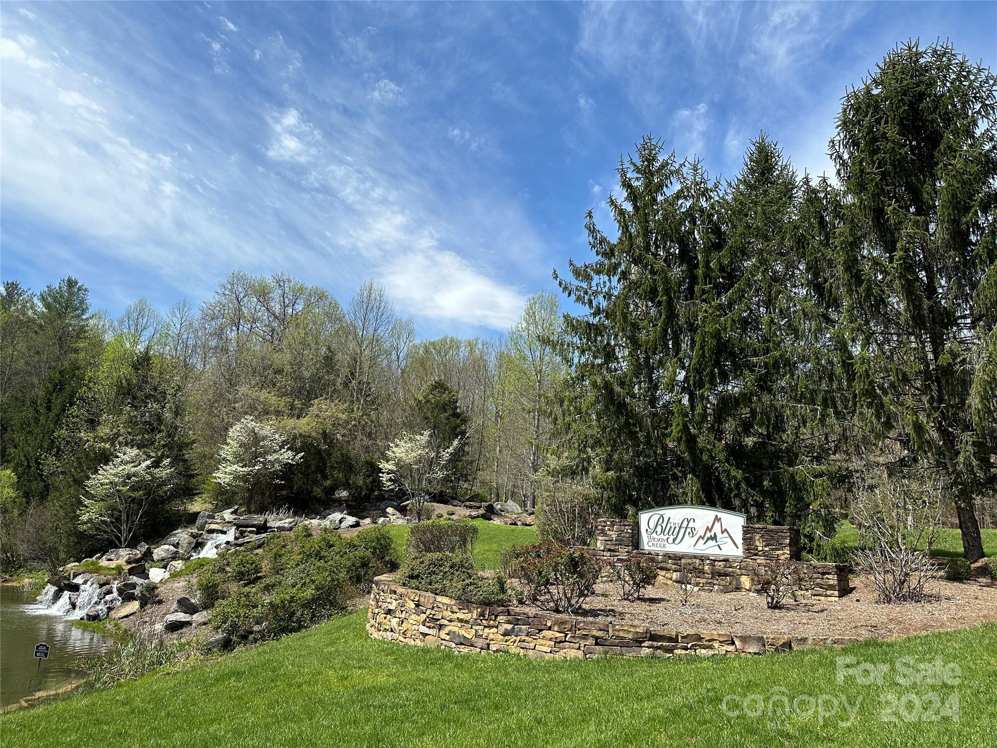 PRICE DECREASE! Call this perfect place home. Build a beautiful home on this 1.57-acre parcel or buy it as an investment. Need a list of builders and designs to choose from? I have you covered. Design and pricing are subject to architectural review and approval. Builder floor plans and finishes are customizable to suit your preferences. For outdoor enthusiasts or those who love green spaces, the Bluffs are your calling—bordered by Pisgah National Forest and offering kayaking, fishing, hiking, waterfalls, and off-road adventures. The Bluffs of Wilson Creek is a ready-made community with paved roads and underground utilities, including power and high-speed internet, all maintained by the HOA for just $400 per year. A hidden treasure is 3.5 miles away: the Wilson Creek National Wild and Scenic River. Wilson Creek, originating from the slopes of Grandfather Mountain, travels 20 miles and flows through a deep 200-foot gorge to join the Johns River. Everyday conveniences are within 10-12 miles. A construction-to-permanent loan is the best financing option for buying and building the lot in one closing. I have additional lots listed in this community, and I can connect you with builders to explore your options. IMPORTANT: Cell service can be spotty in pockets. Please use GPS in advance and download the map for offline use. Lot 132 -  https://maps.app.goo.gl/ZK8Zzg5dmwm1JTDw7 (copy & paste into browser)
